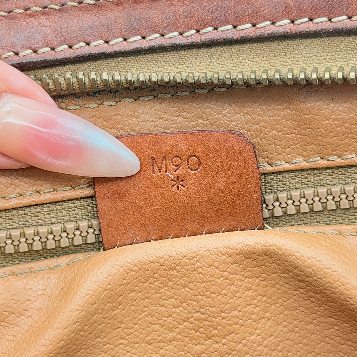 Celine Triomphe Macadam Clutch Bag in brown coated canvas with leather trim, photographed on a white background.
