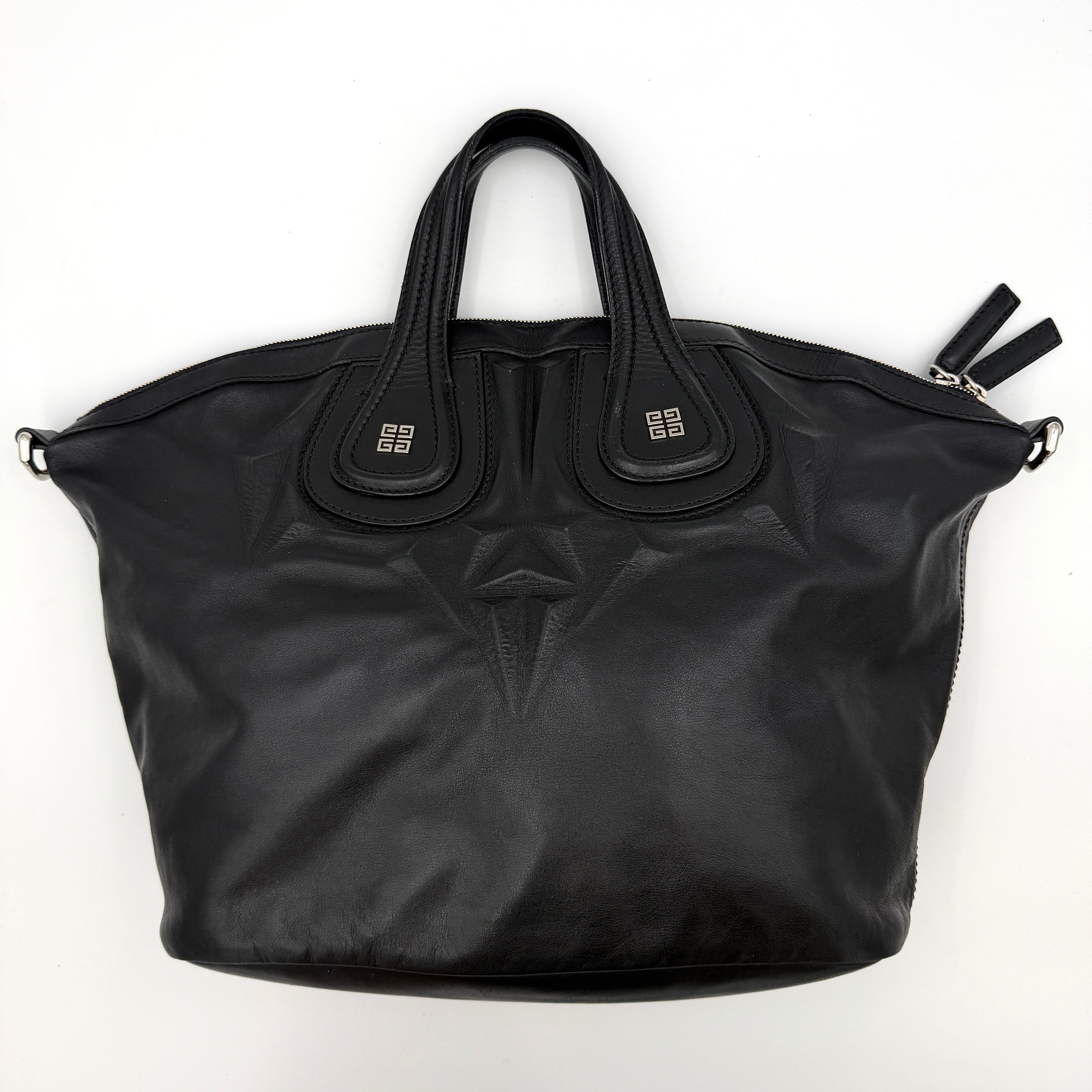 Givenchy 2Way Nightingale Handbag in black leather with detachable strap and striking front motif.