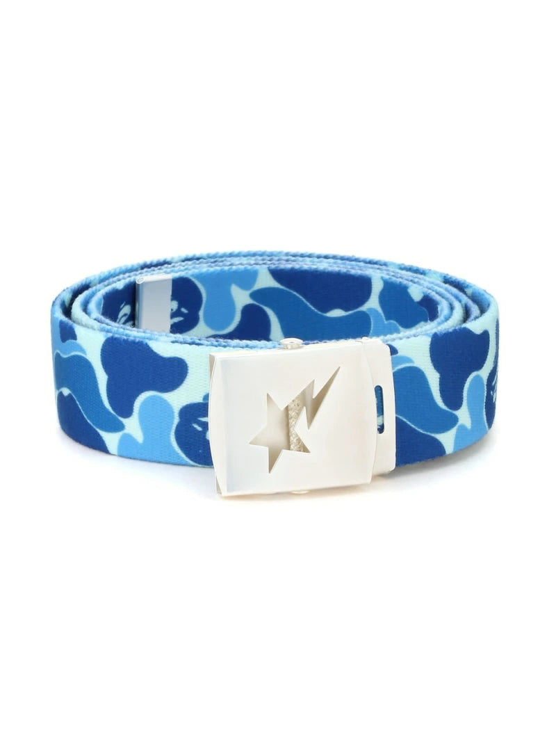 BAPE ABC Camo GI Belt Blue, featuring blue camo webbed strap and silver-tone buckle with engraved BAPE Sta logo.