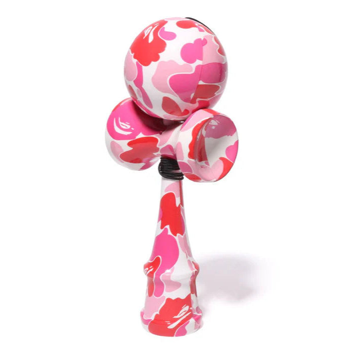 BAPE ABC Camo Kendama Pink, wooden skill toy featuring all-over pink, red, and white camo print in glossy finish.