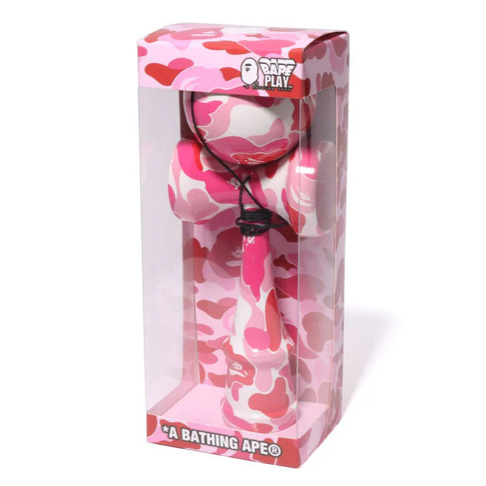 Shop the BAPE ABC Camo Kendama in pink with bold camo print. A collectible Japanese toy reimagined with streetwear style. Pre-loved edition.