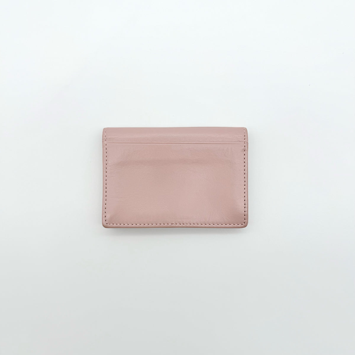 Vivienne Westwood light pink leather card case with silver-tone Orb emblem and sleek, structured design.