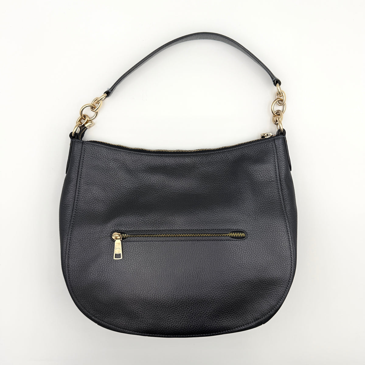 Coach Elle Hobo bag in navy blue pebbled leather with gold hardware and a detachable strap, styled on a white background.