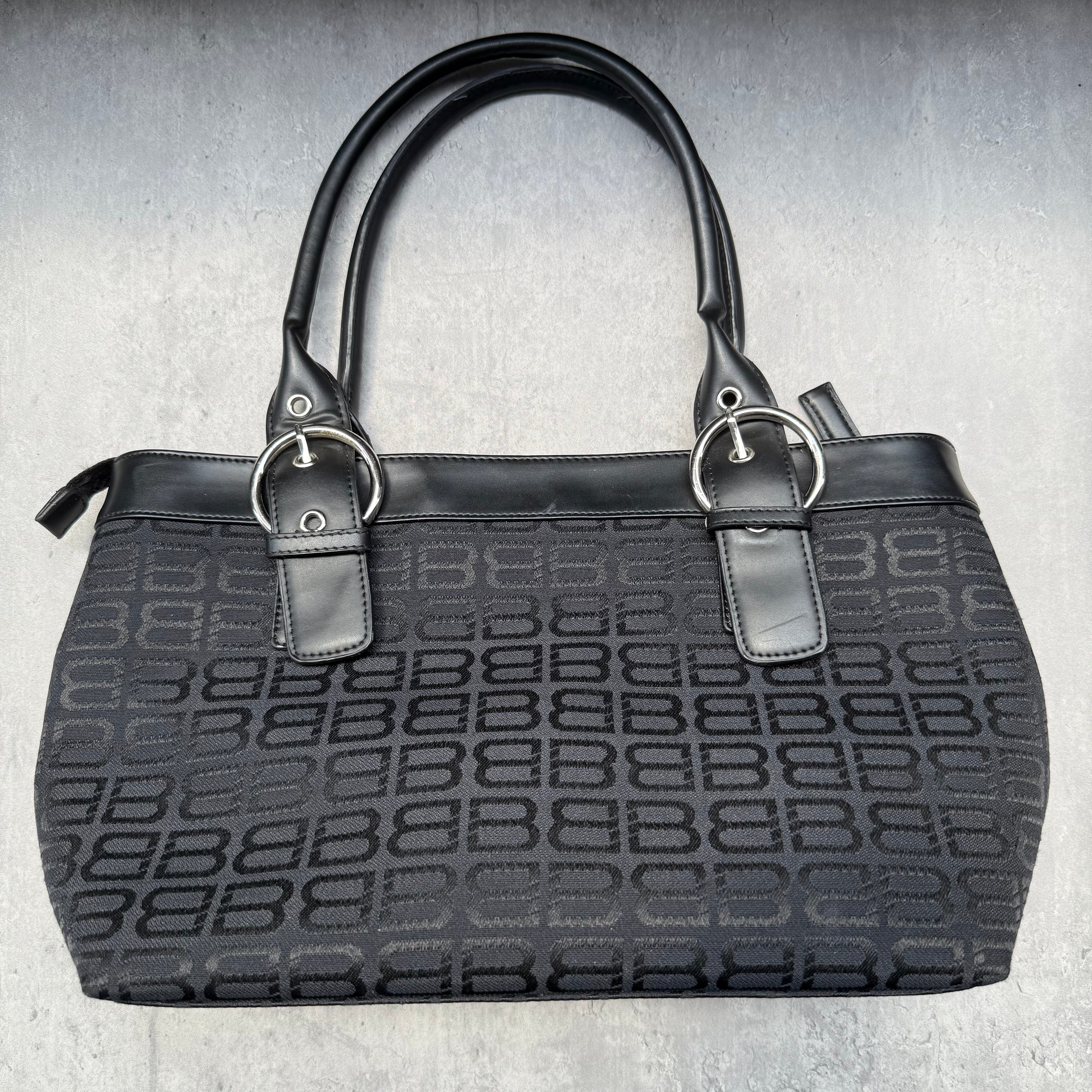Balenciaga BB Logo Handbag in black canvas with leather trim, dual top handles, and zippered compartment interior.