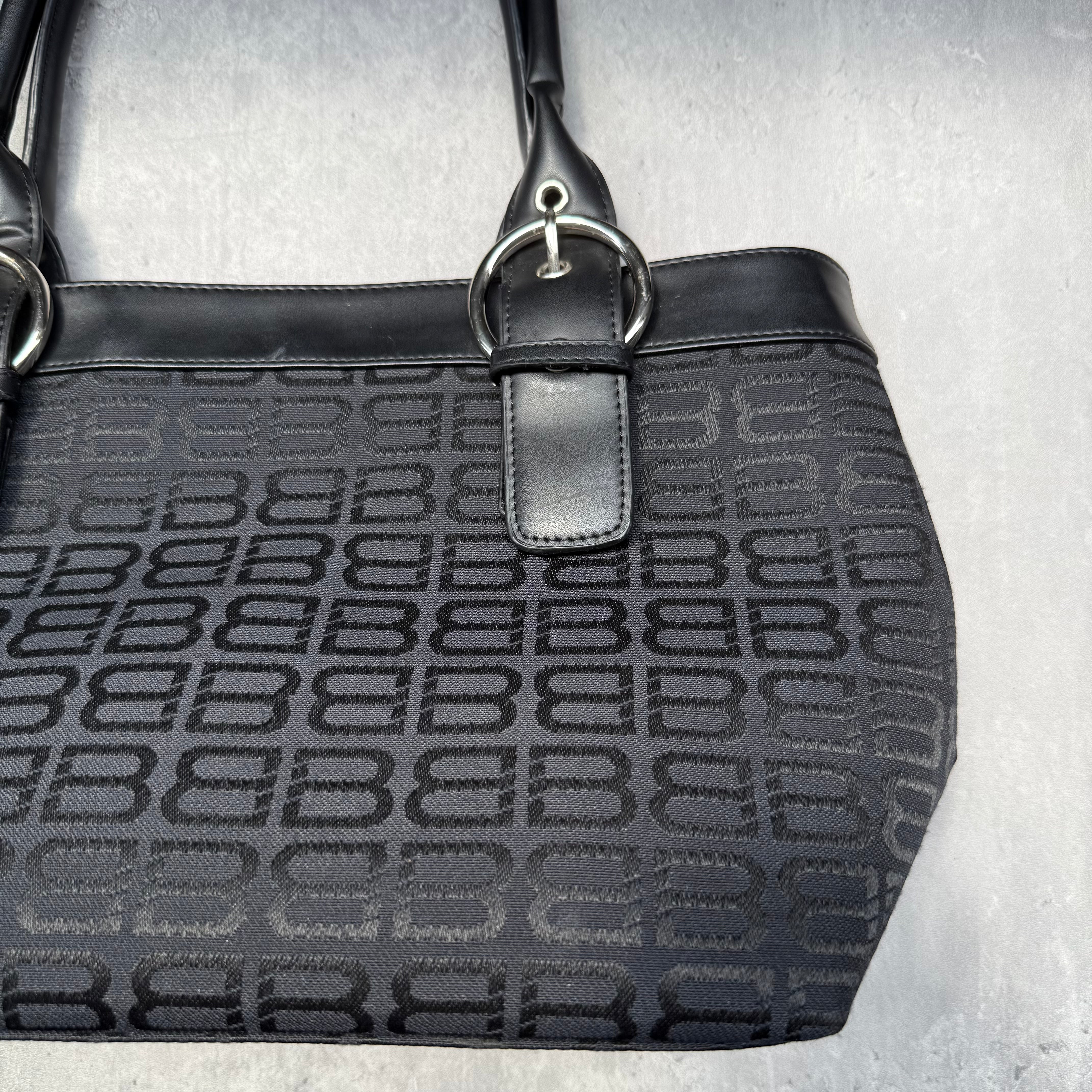 Balenciaga BB Logo Handbag in black canvas with leather trim, dual top handles, and zippered compartment interior.
