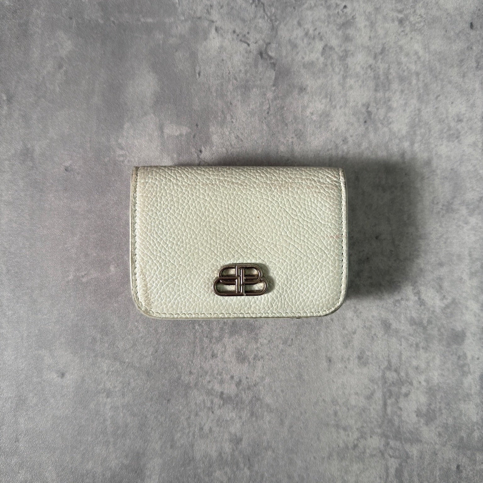 Balenciaga BB Logo Mini Tri-fold White Leather Wallet with silver BB logo, showcasing internal compartments and minimal wear.