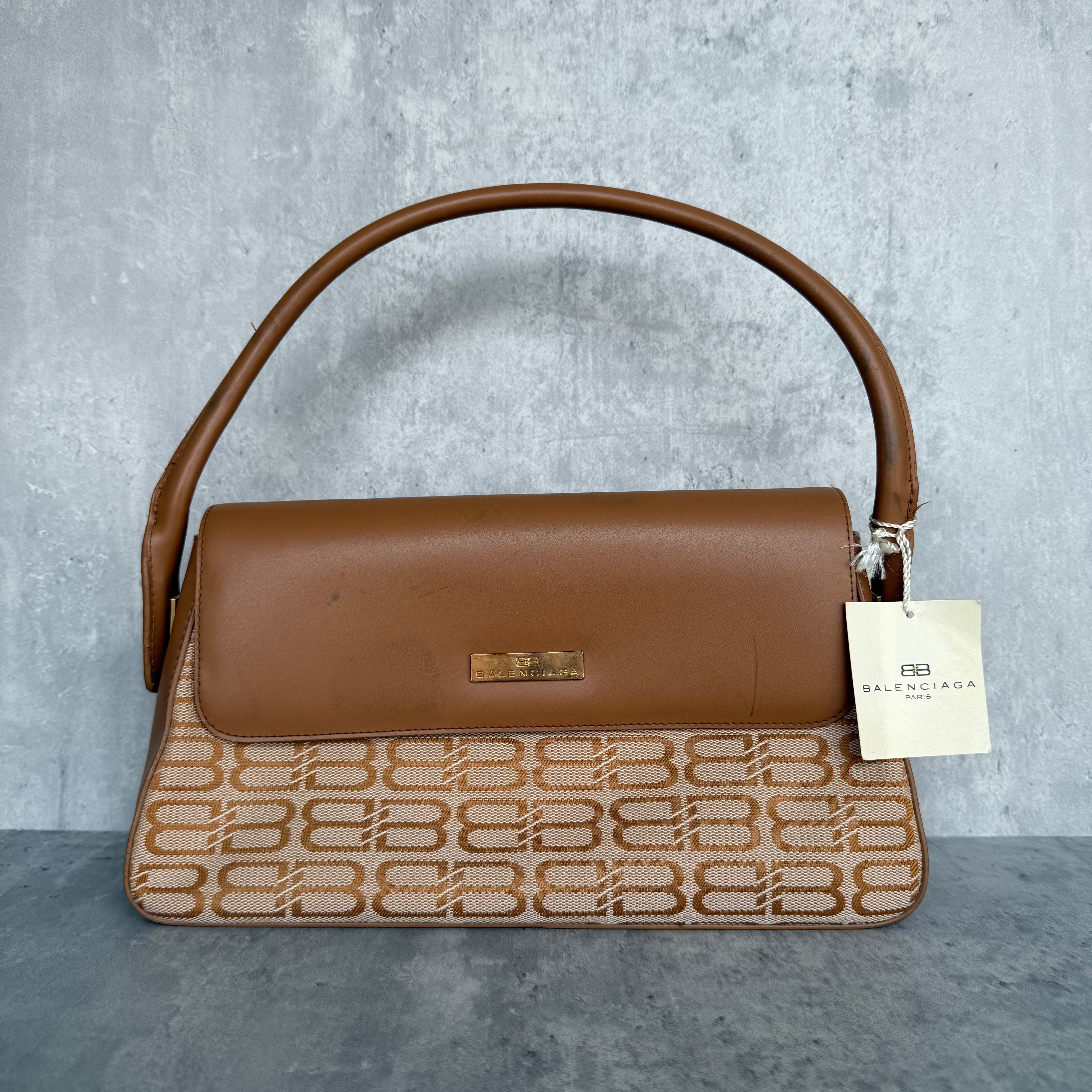 Balenciaga BB Monogram Shoulder Bag in Beige/Brown, crafted with BB canvas and brown leather flap, gold-tone logo plaque, and curved handle