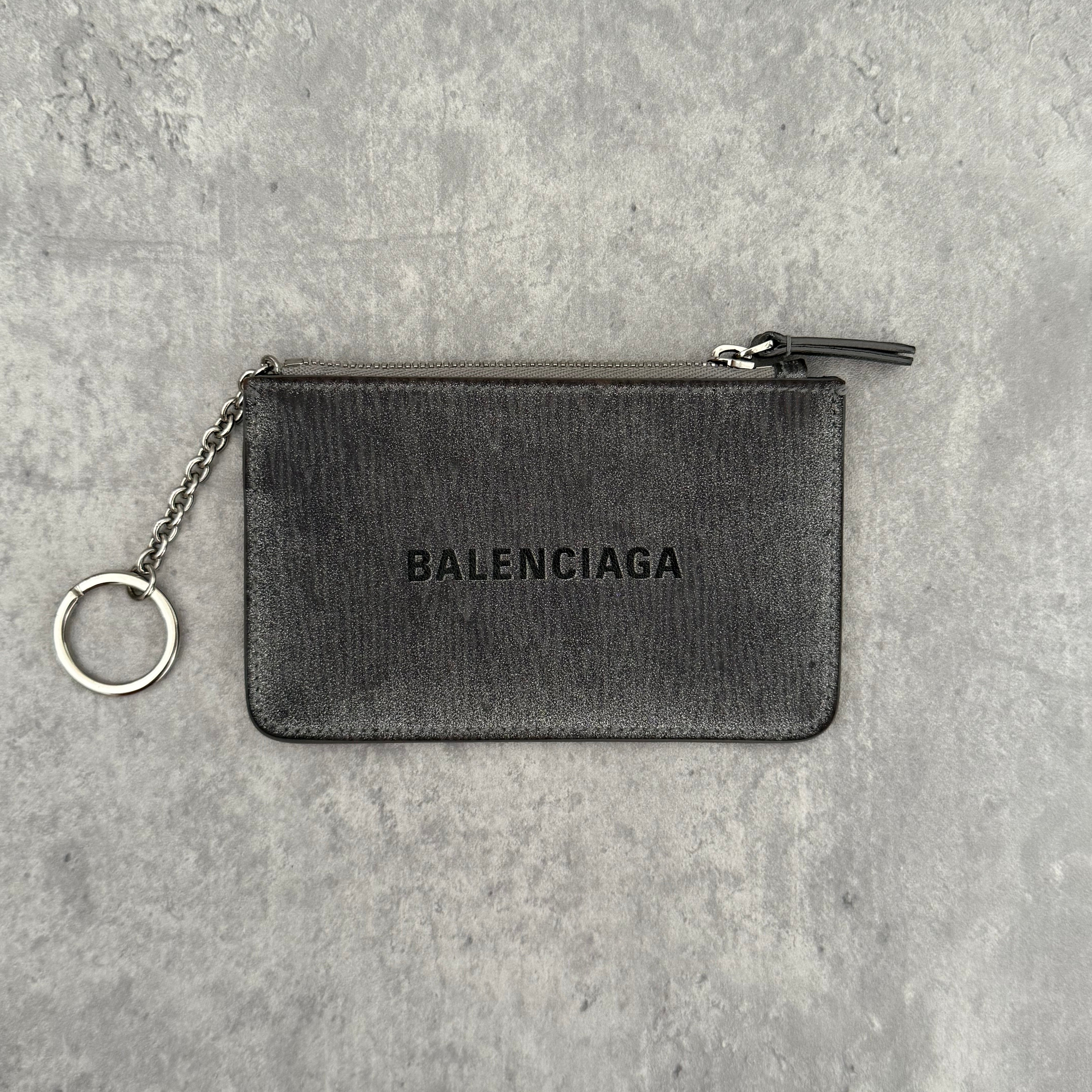 Balenciaga Graphic Print Silver Wallet, metallic silver leather with bold black logo and zip closure with keyring chain.