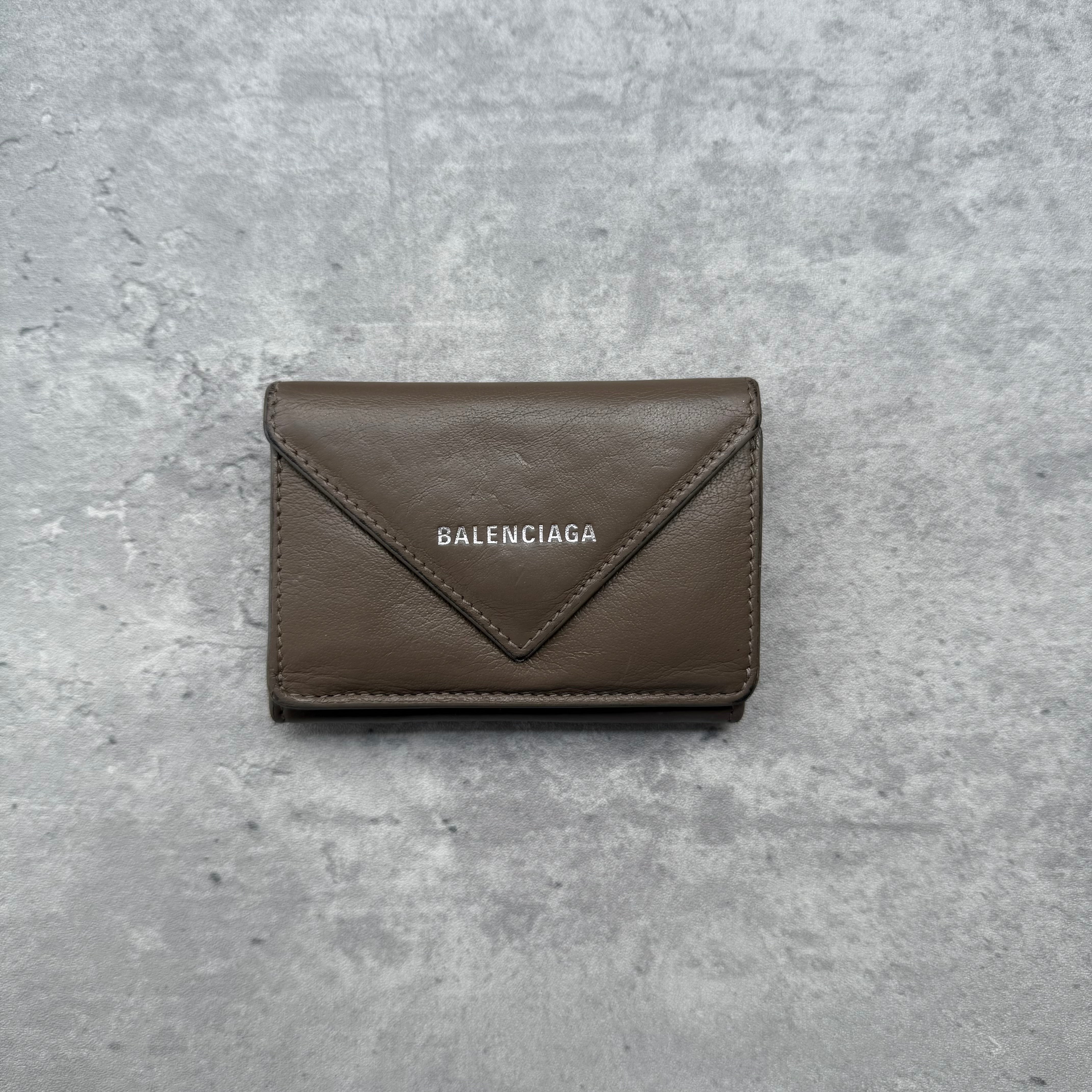 Balenciaga Papier Mini Wallet in brown leather with envelope flap design, silver logo, card slots, bill compartment, and coin pocket.