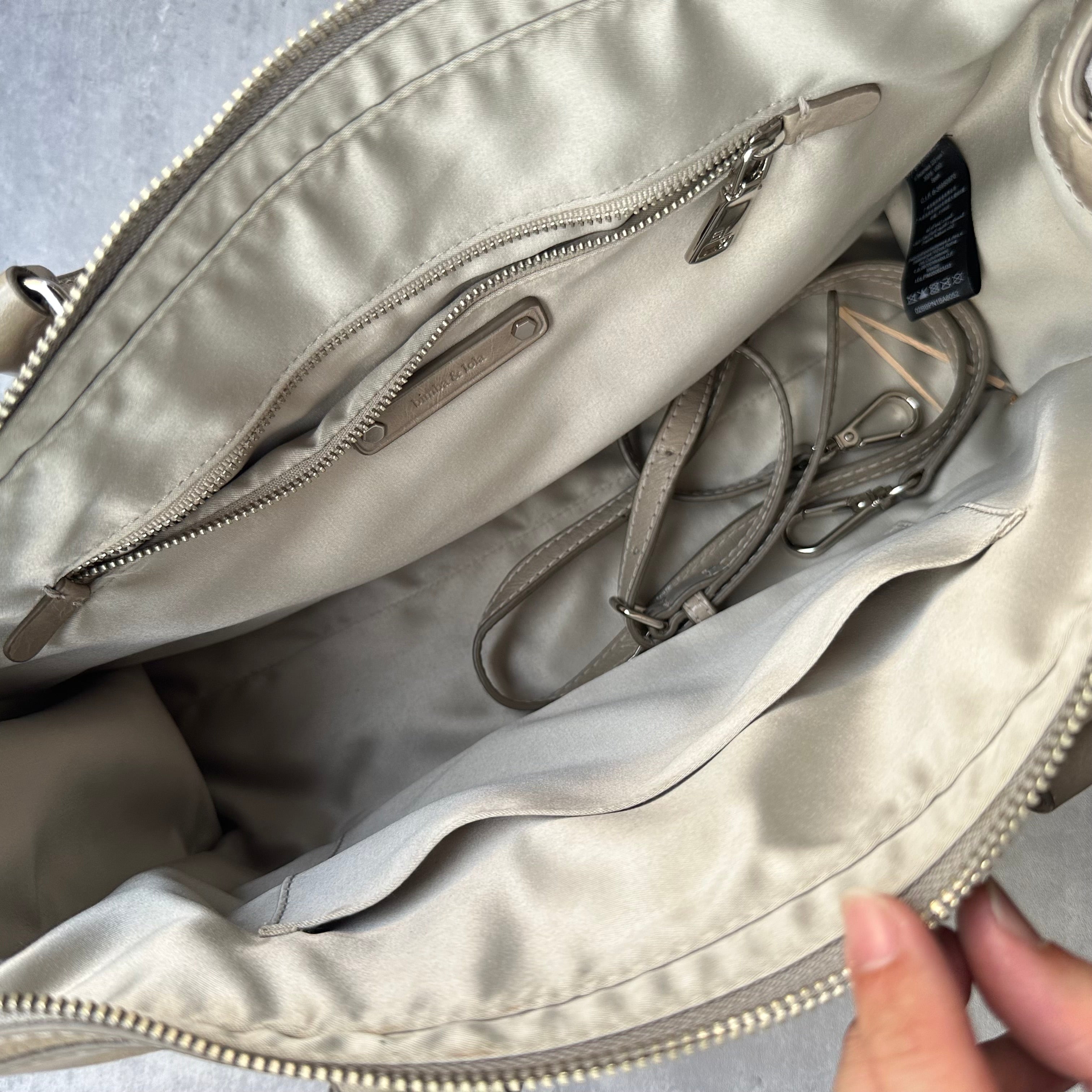 Interior of Bimba & Lola shoulder bag with satin lining and compartments