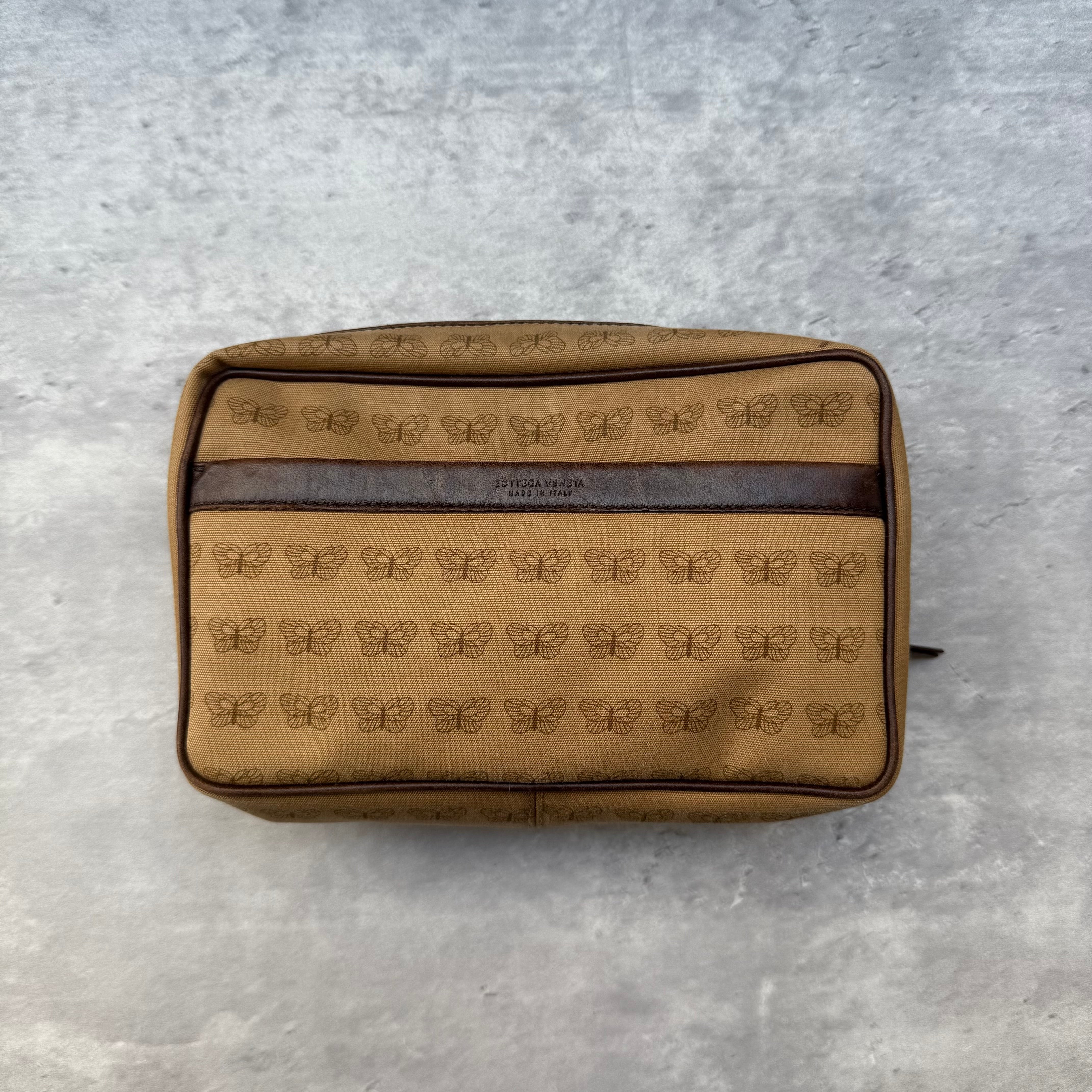 Bottega Veneta Butterfly Pouch Brown canvas with all-over butterfly monogram, leather trim, and gold-tone zipper.