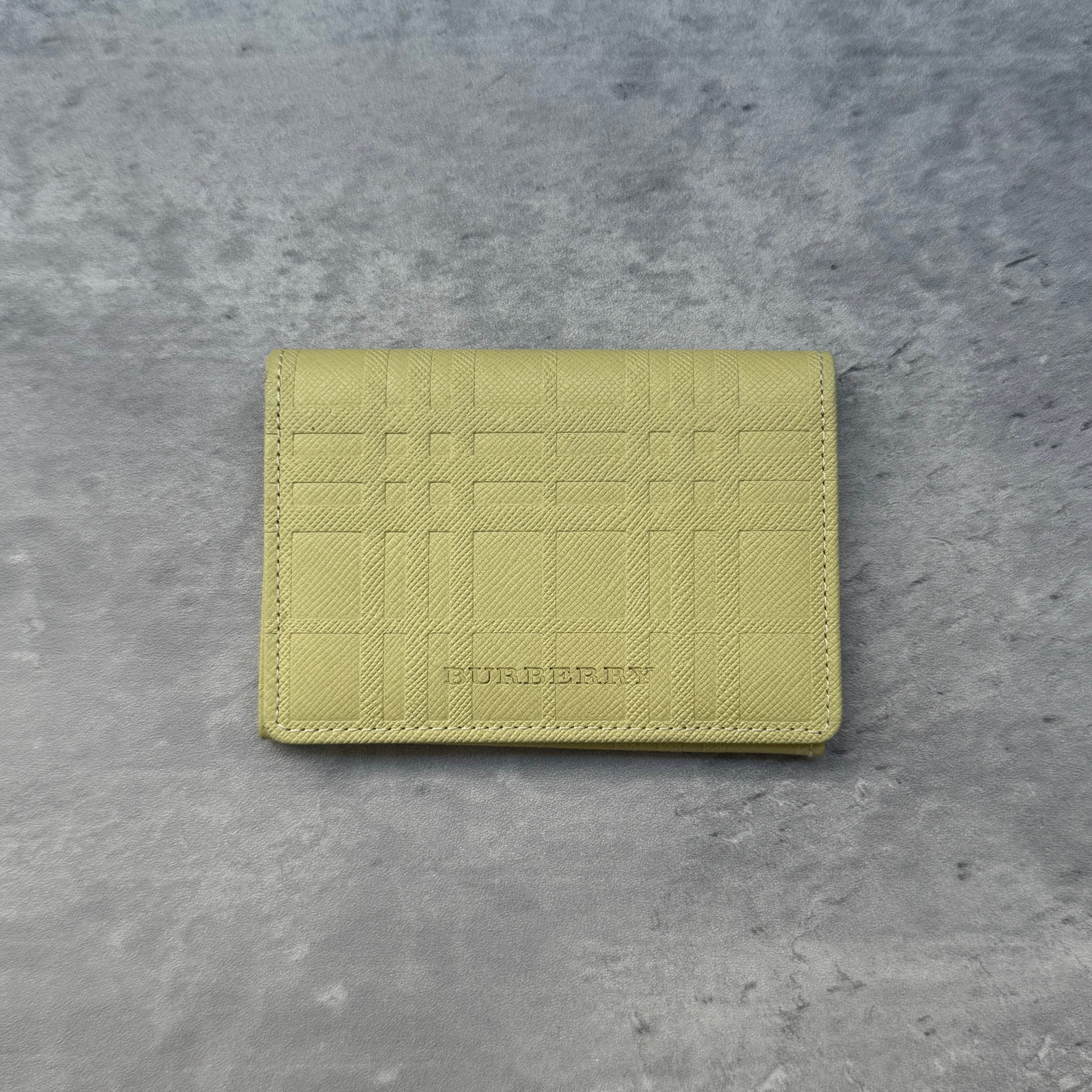 Burberry Nova Check Cardholder Yellow, embossed leather wallet with signature check pattern, bi-fold design and multiple compartments.