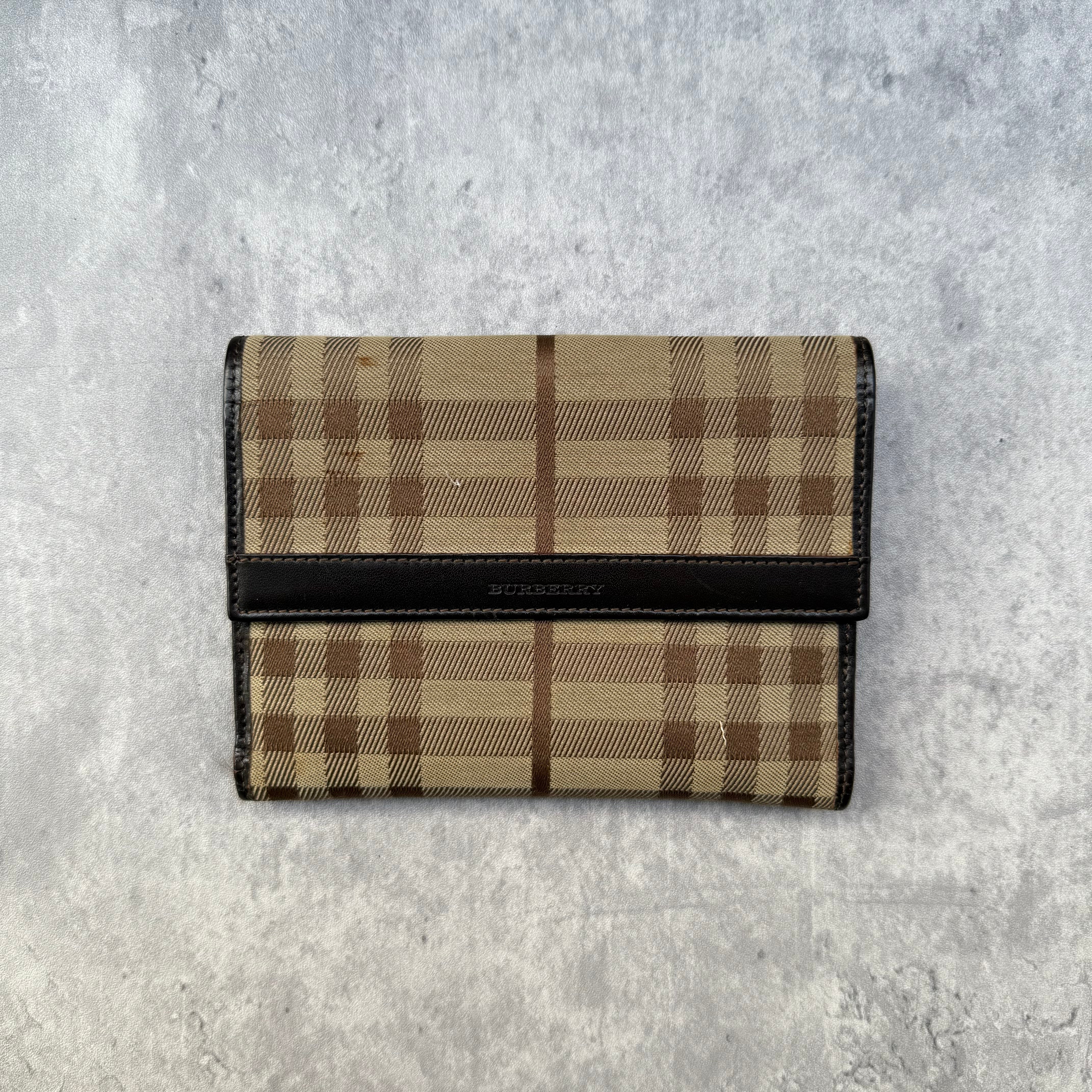 Burberry Nova Check Wallet in beige tartan canvas with brown leather trim, fold-out design, and multiple compartments.