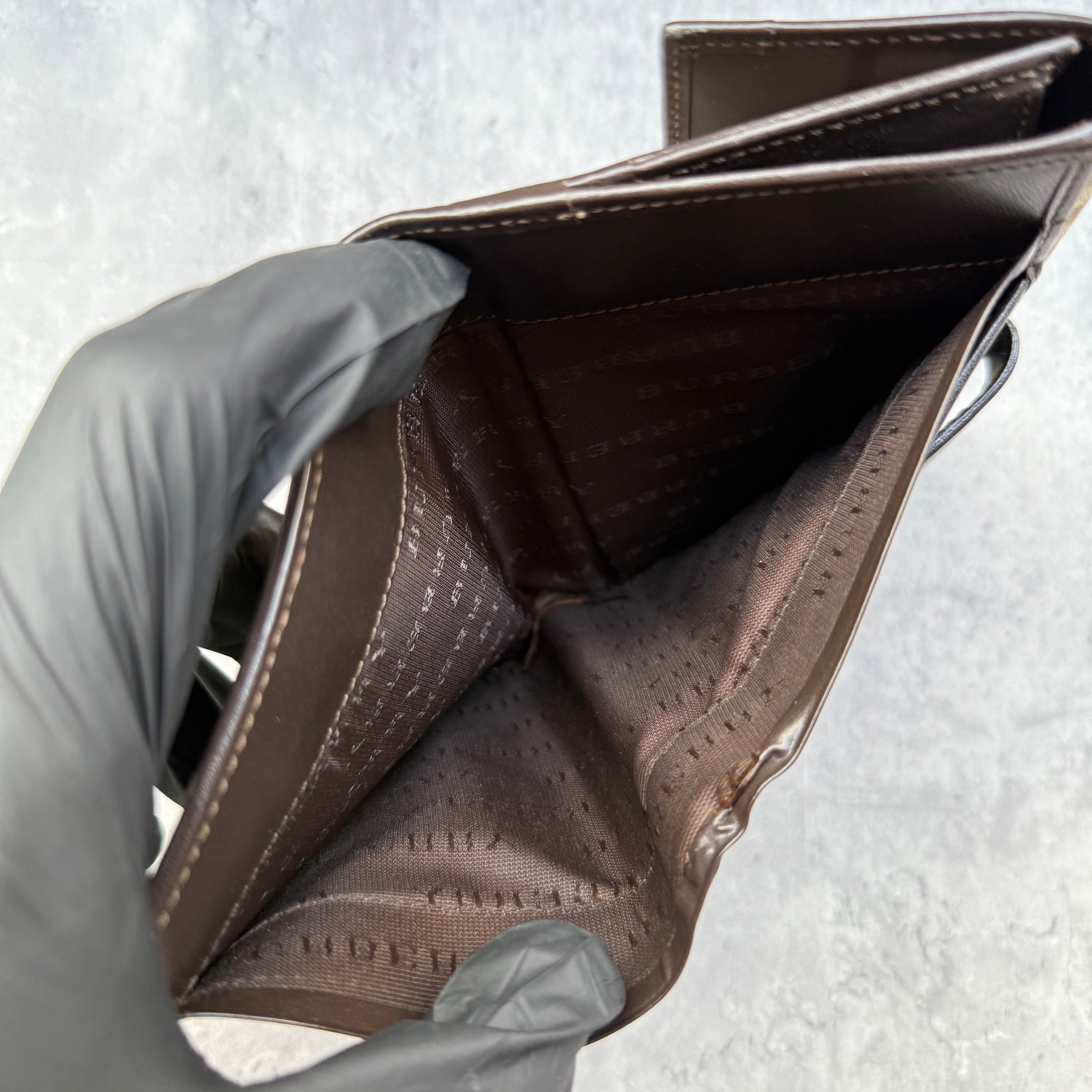 Burberry Nova Check Wallet in beige tartan canvas with brown leather trim, fold-out design, and multiple compartments.