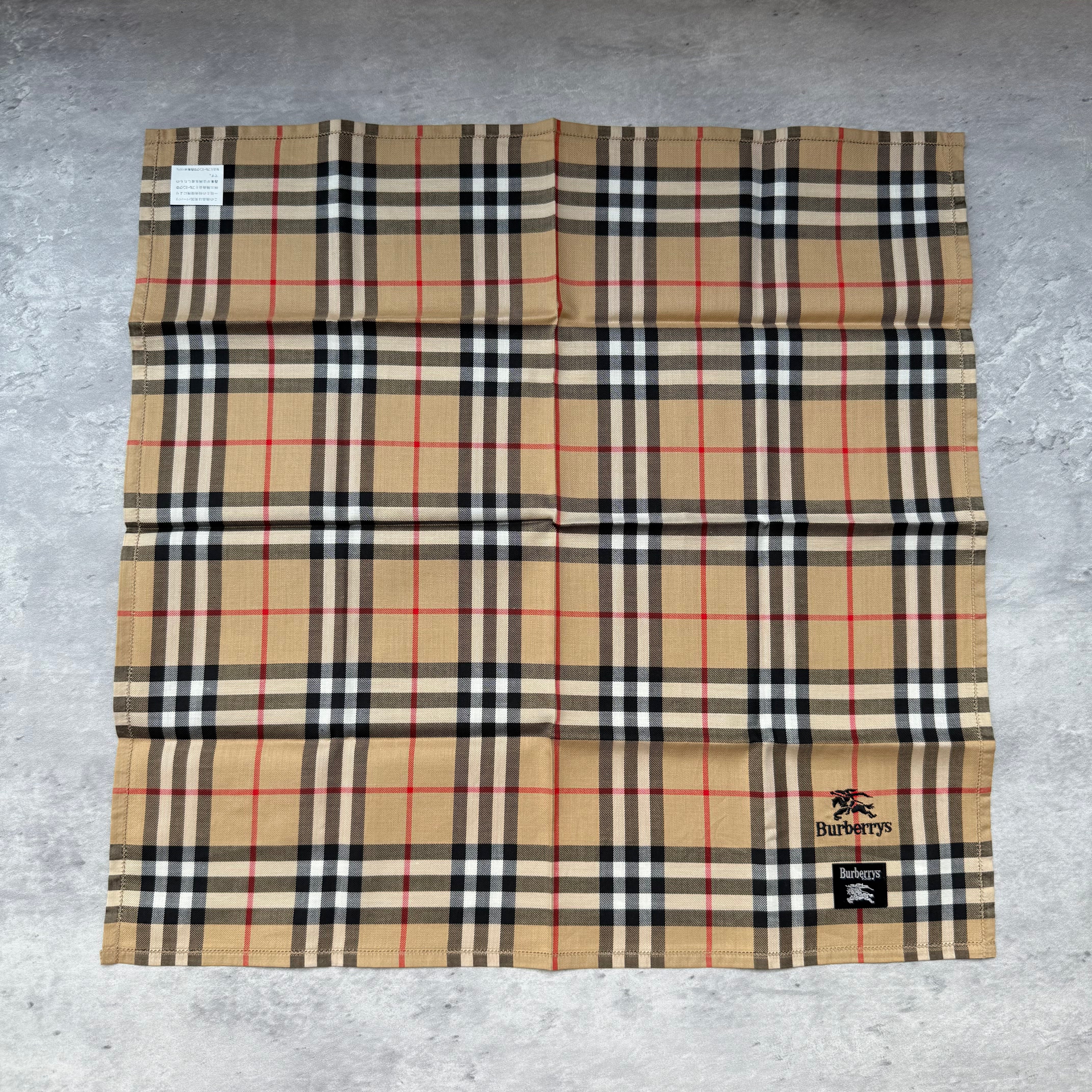Burberry Vintage ‘Burberrys’ Nova Check Scarf in beige with black and red check pattern and embroidered logo.