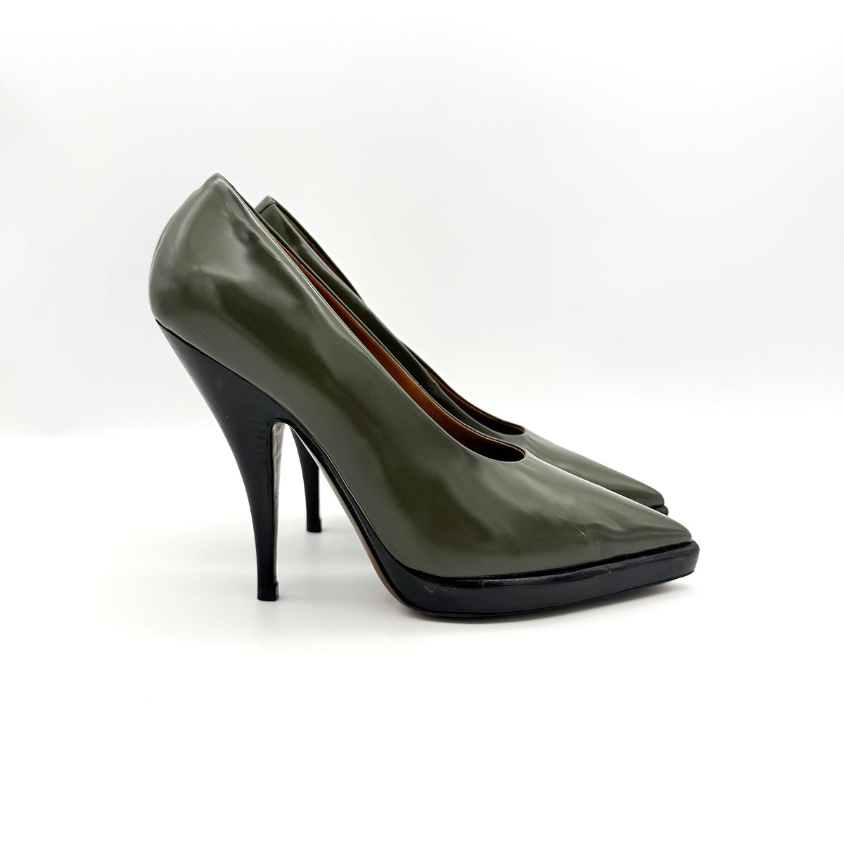Celine olive green leather heels with pointed toe and black stiletto heel, displayed against a white background