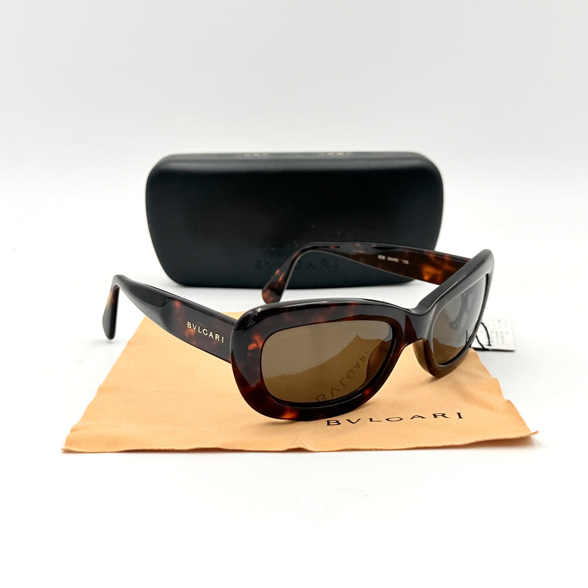 Bvlgari 808 sunglasses in tortoiseshell brown acetate displayed with original case and cloth.