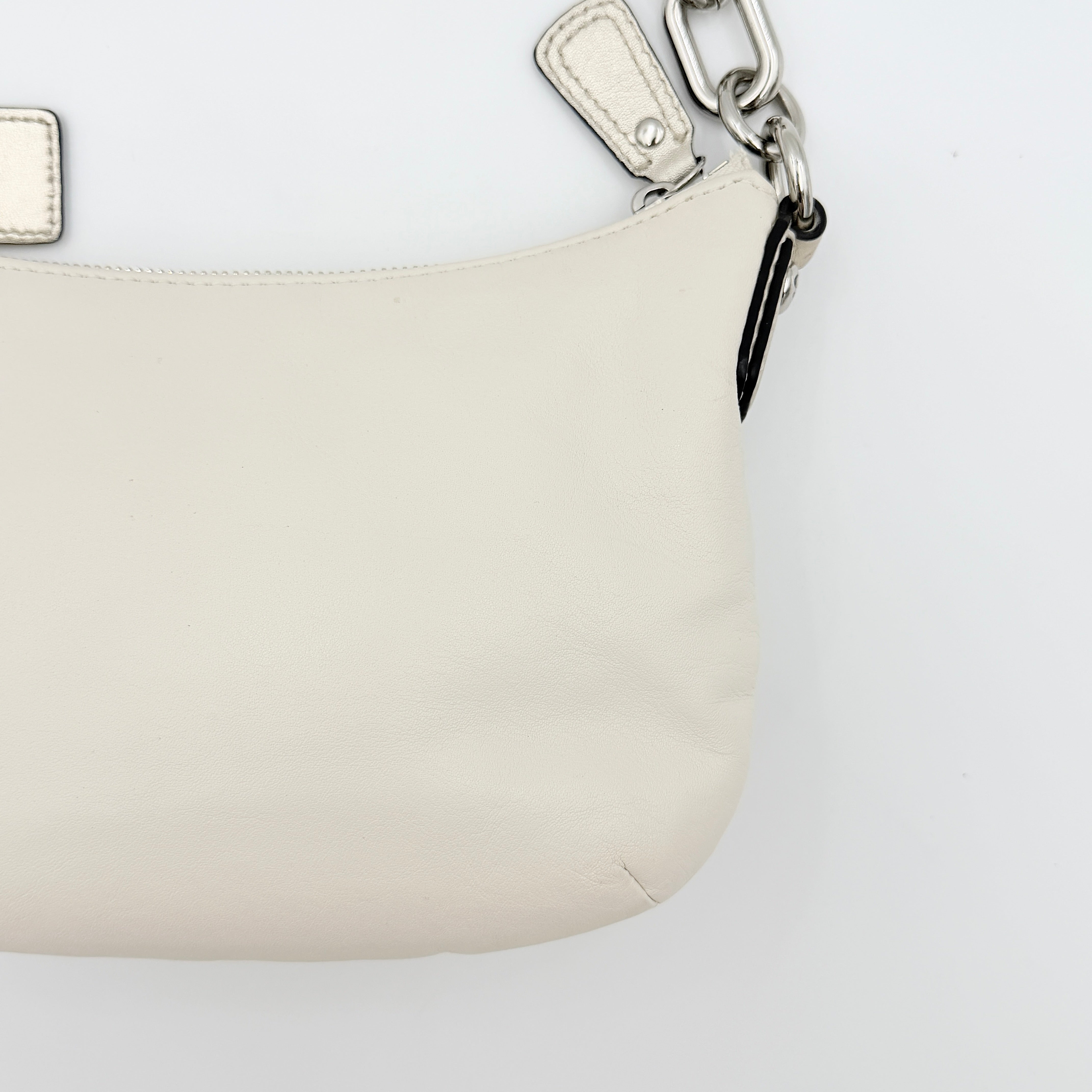 Coach Kristin Hobo Shoulder Bag in ivory leather with silver-tone hardware and a structured short strap.
