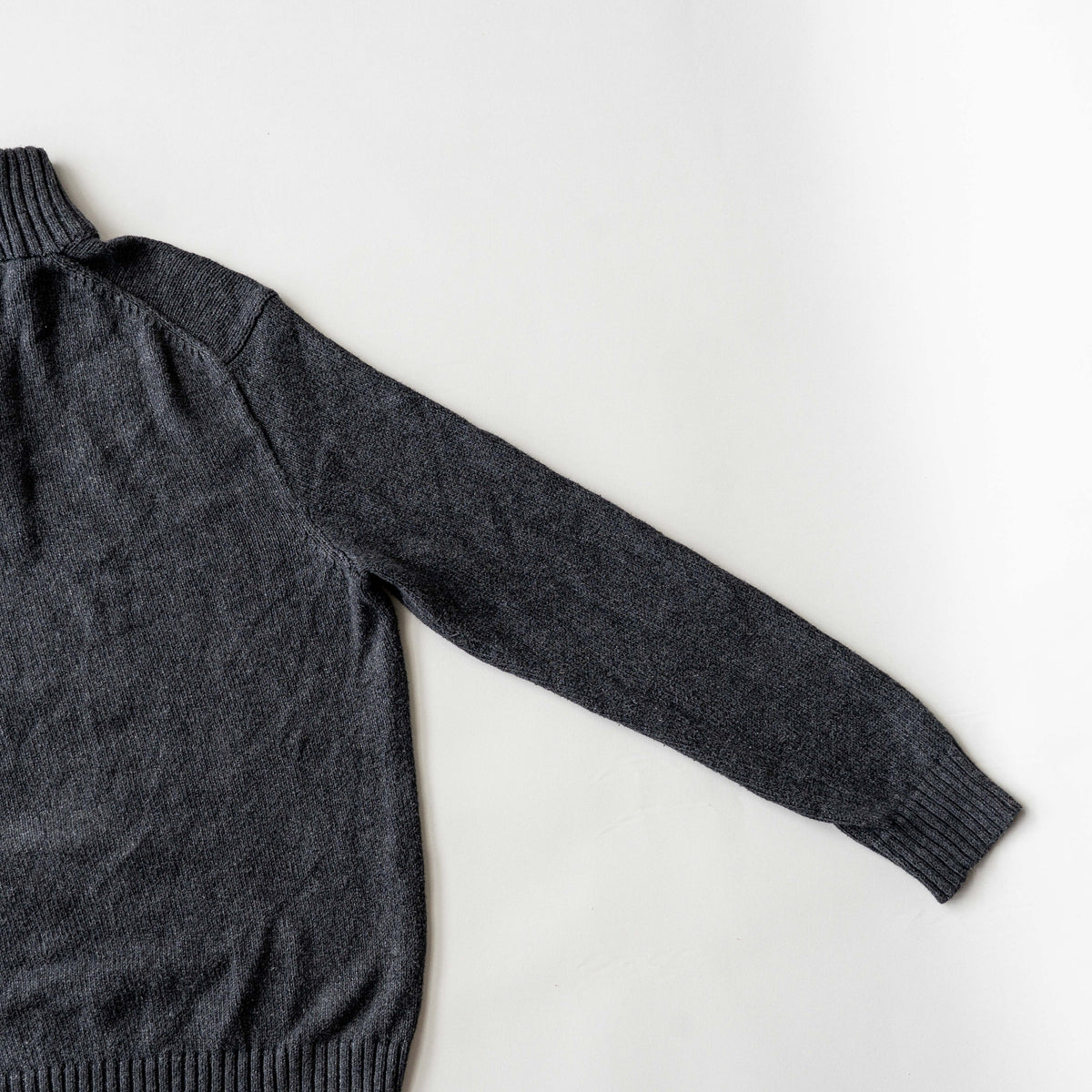Dark grey Polo Ralph Lauren quarter zip mockneck pullover sweater with ribbed collar and green pony logo.