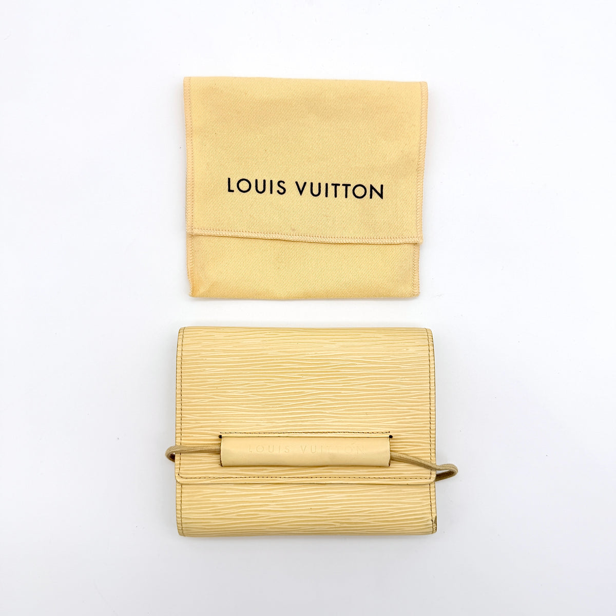 Louis Vuitton Epi Portefeuille Élastique Trifold Wallet in Vanilla Cream with dust bag, presented against a clean white background.