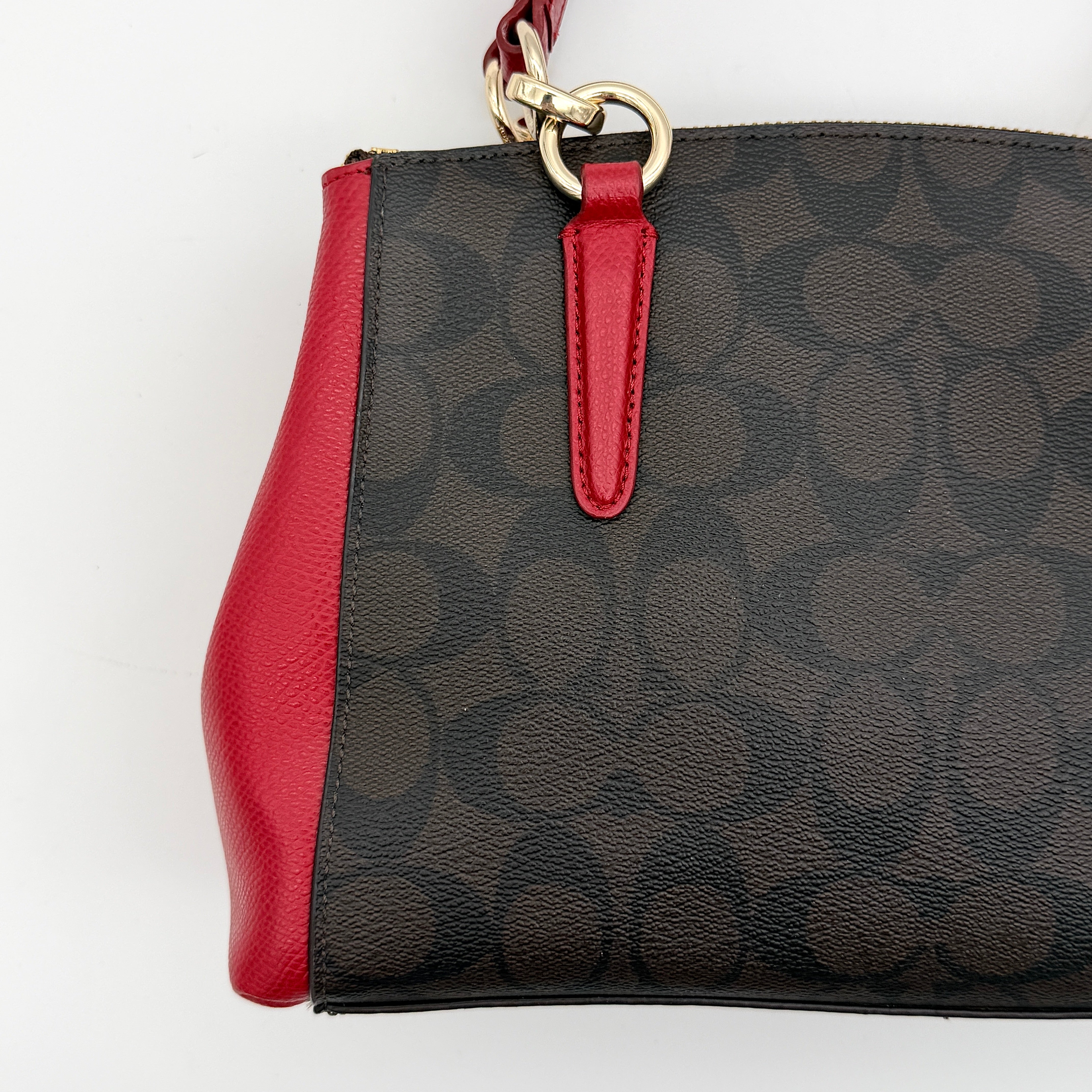 Coach 2Way Christie Carryall in brown coated canvas with red leather handles and sides, gold hardware, shown with detachable strap.