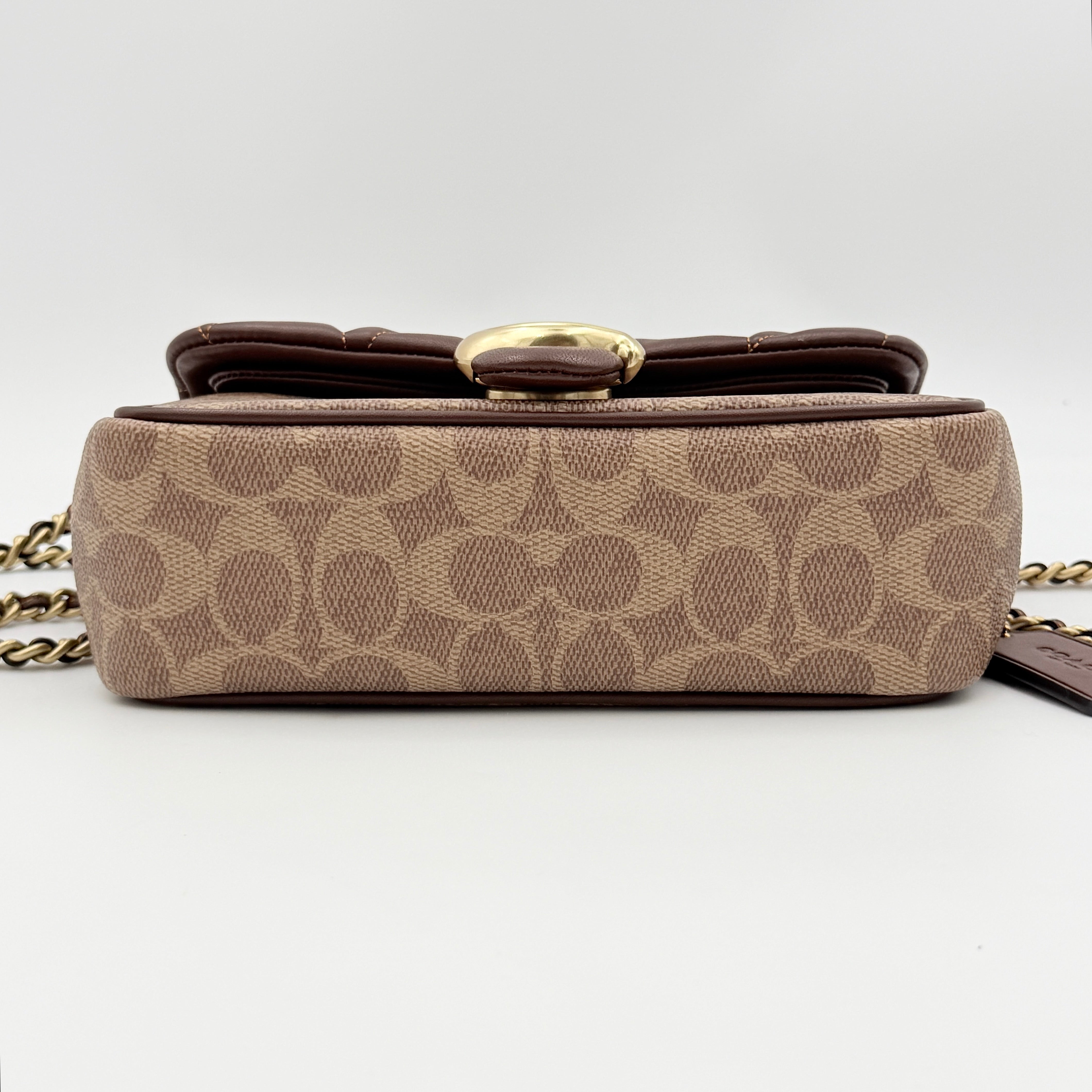 Coach Signature Quilted Tabby Shoulder Bag in brown monogram canvas with gold chain strap and oversized C clasp.
