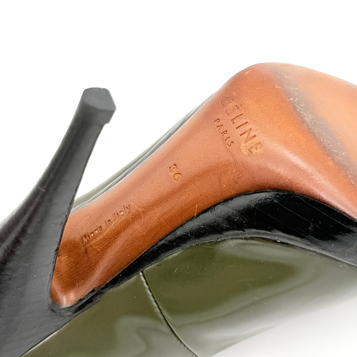 Celine olive green leather heels with pointed toe and black stiletto heel, displayed against a white background