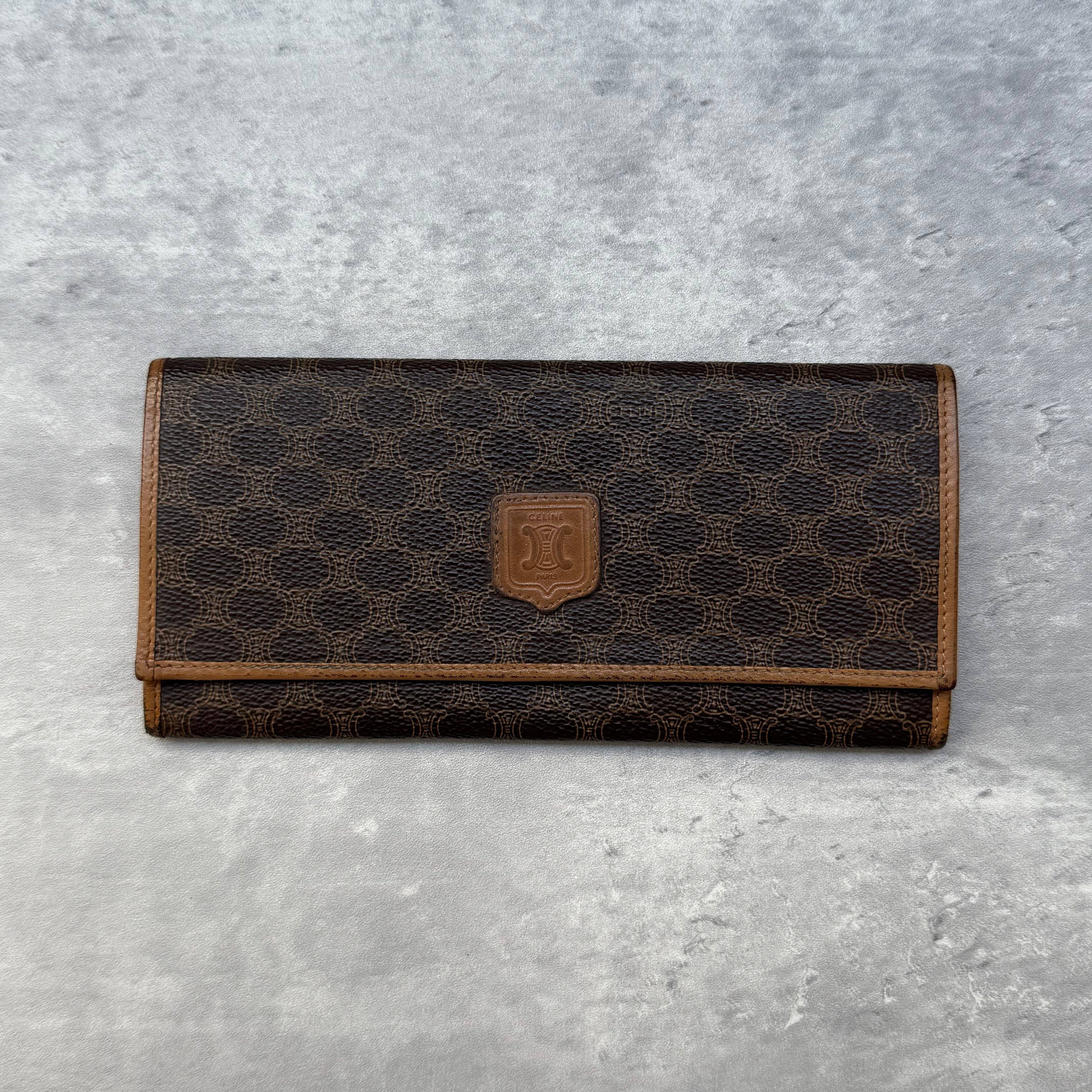 Celine Macadam Bifold Vintage Long Wallet in brown coated canvas with leather trim and tan leather interior.