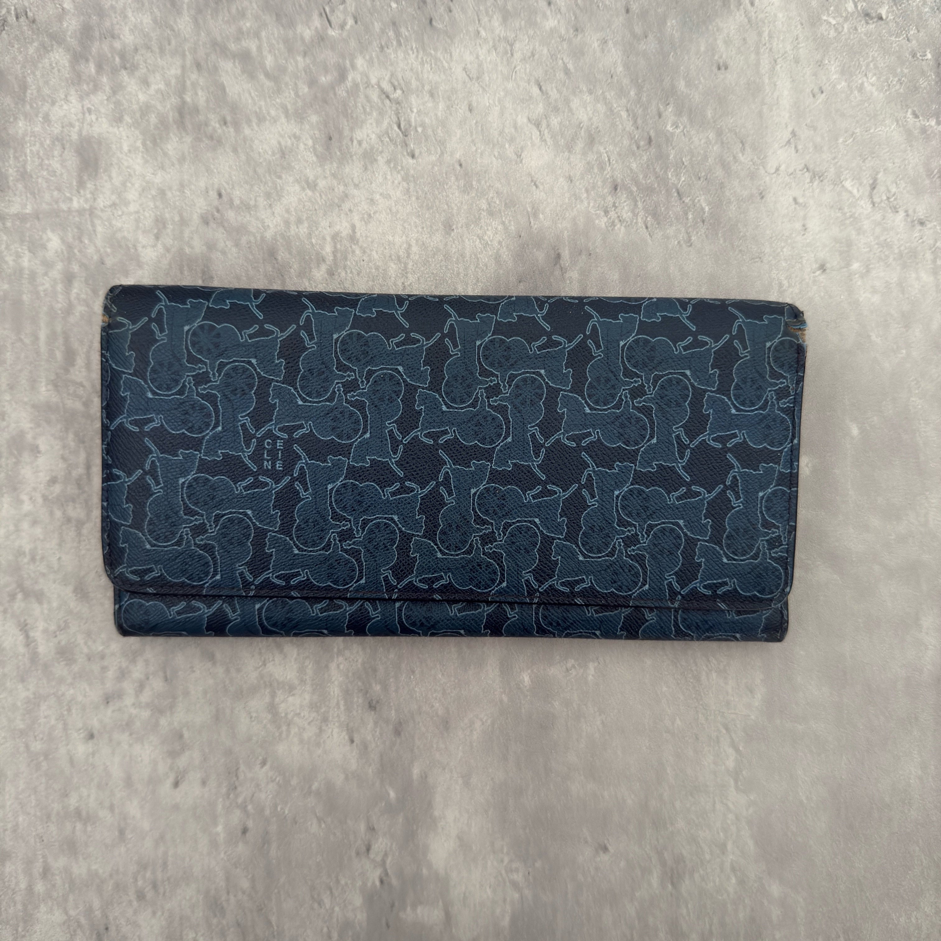 Celine Macadam Carriage Navy Blue Long Wallet featuring signature carriage monogram canvas, blue leather interior, and multiple compartments for organization.