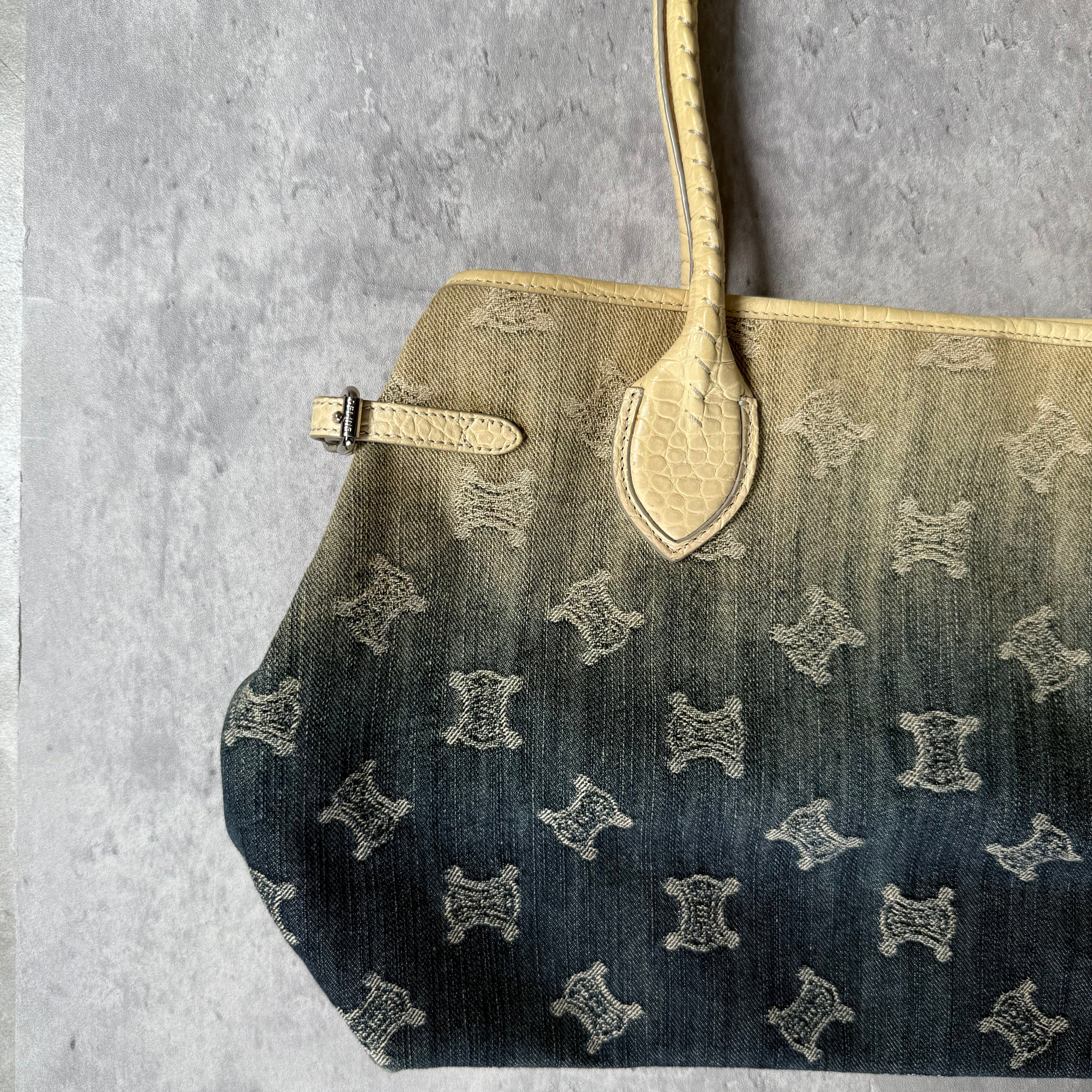 Celine Macadam Gradient Denim Shoulder Bag with beige leather trim, logo print, floral interior lining, and dual handles.