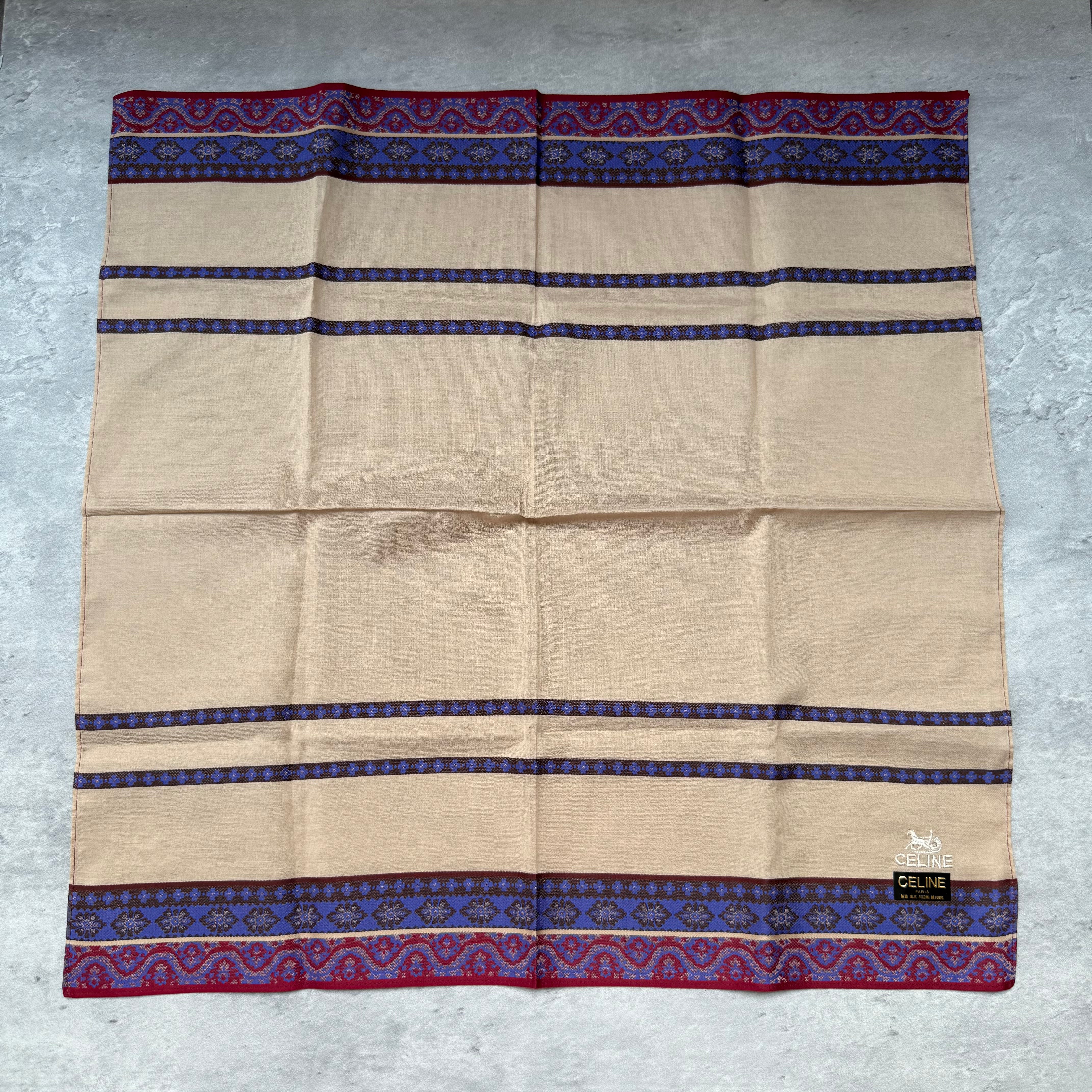 Celine Vintage Scarf in beige with multicolor red and blue patterned borders and Celine logo detail.