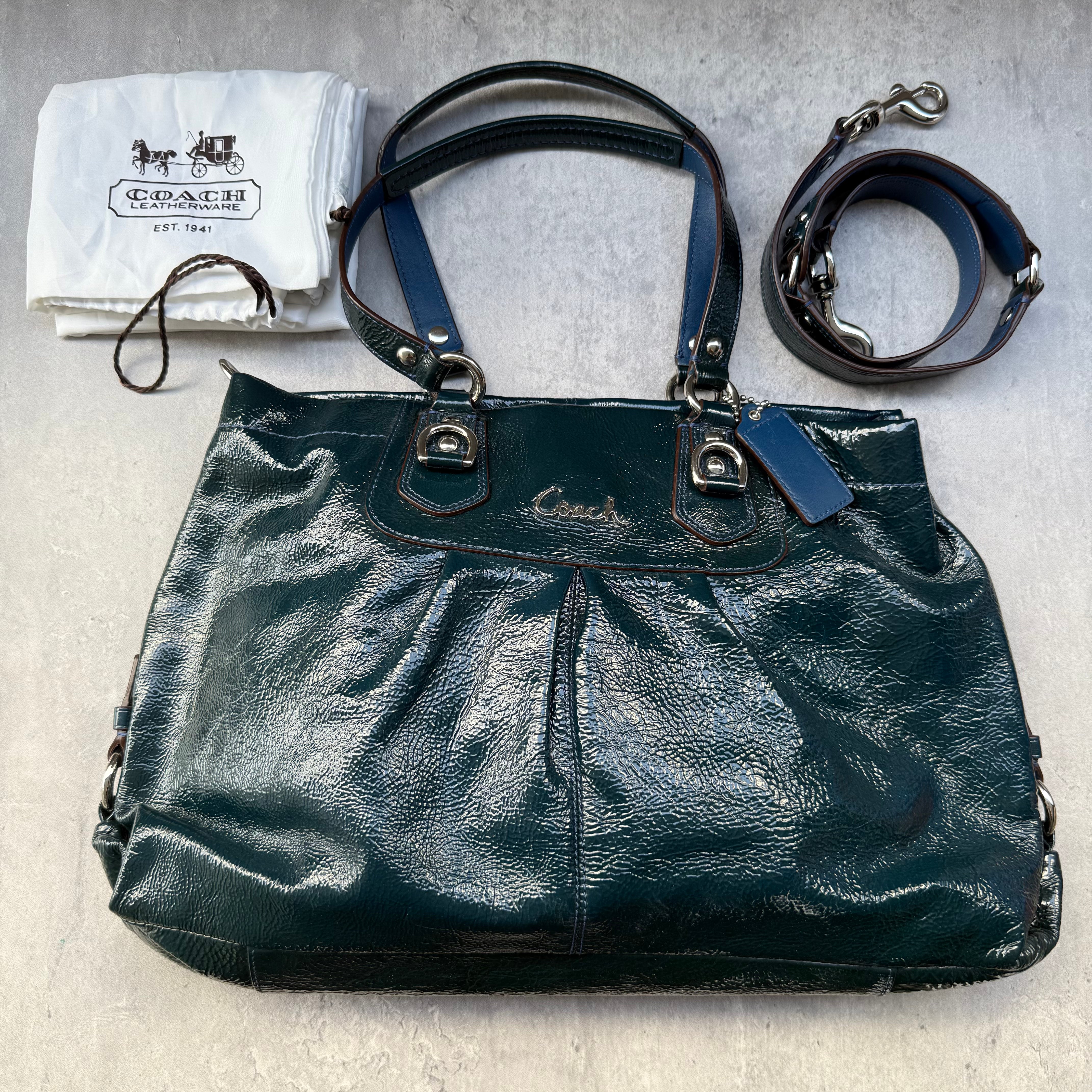 Coach 2Way Ashley Glossy Patent Satchel Bag in teal patent leather with dual handles, detachable strap, and dust bag.