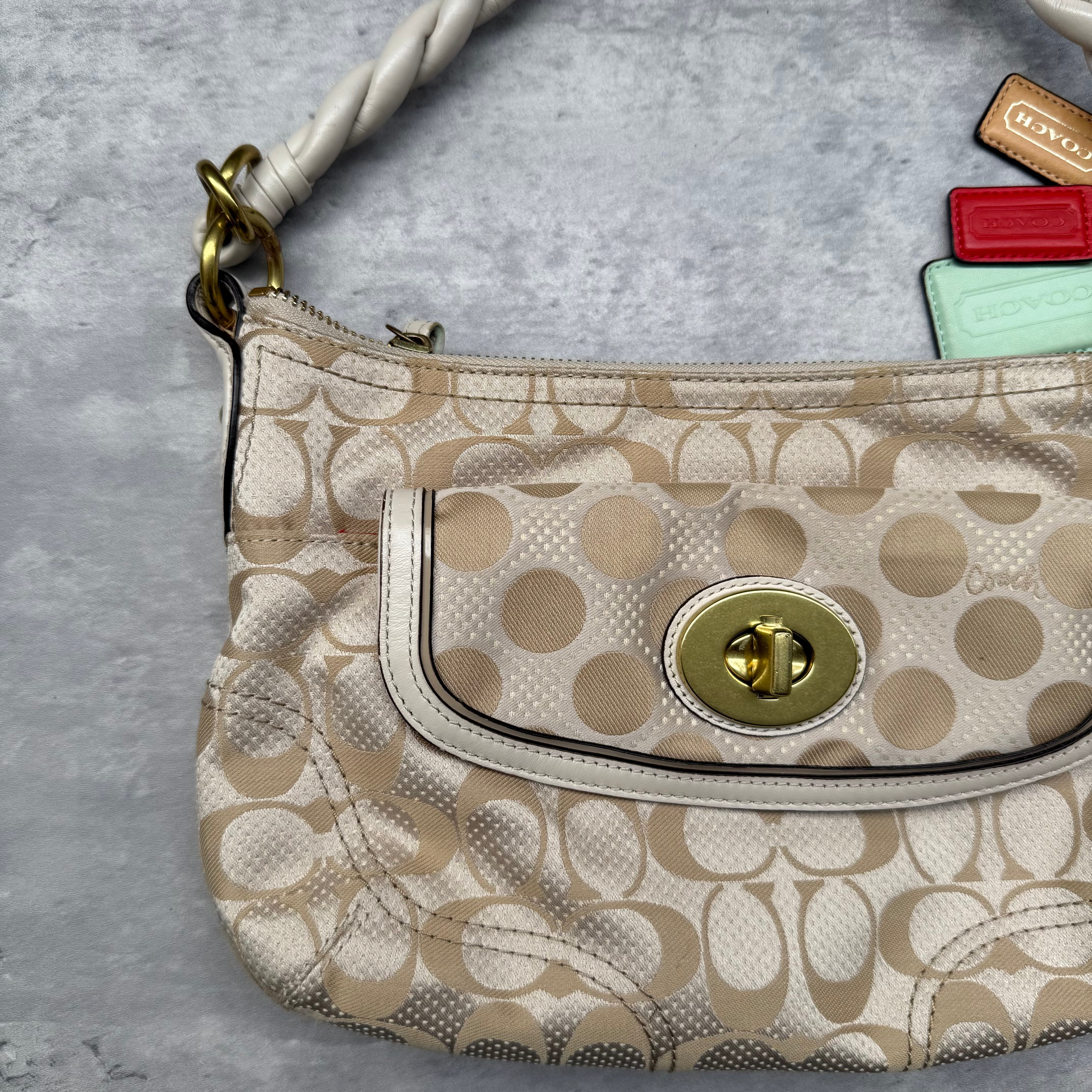 Coach 2Way Signature Dot Satin Canvas Shoulder Bag in beige with braided handle, turn-lock pocket, colorful hang tags, and red interior