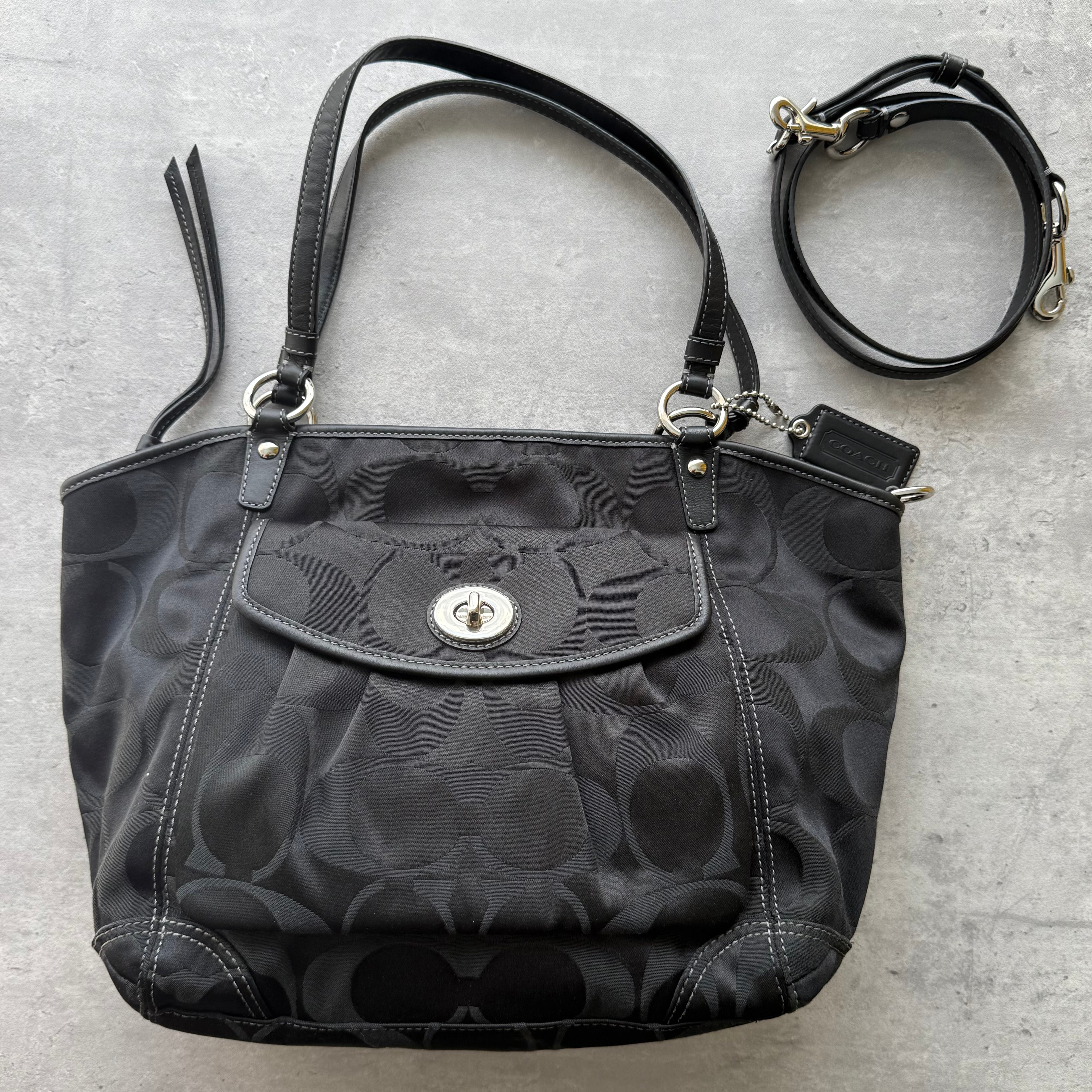 Coach 2Way Signature Leah Shoulder Bag in black jacquard with tonal monogram, leather trim, silver-tone hardware, and detachable strap.