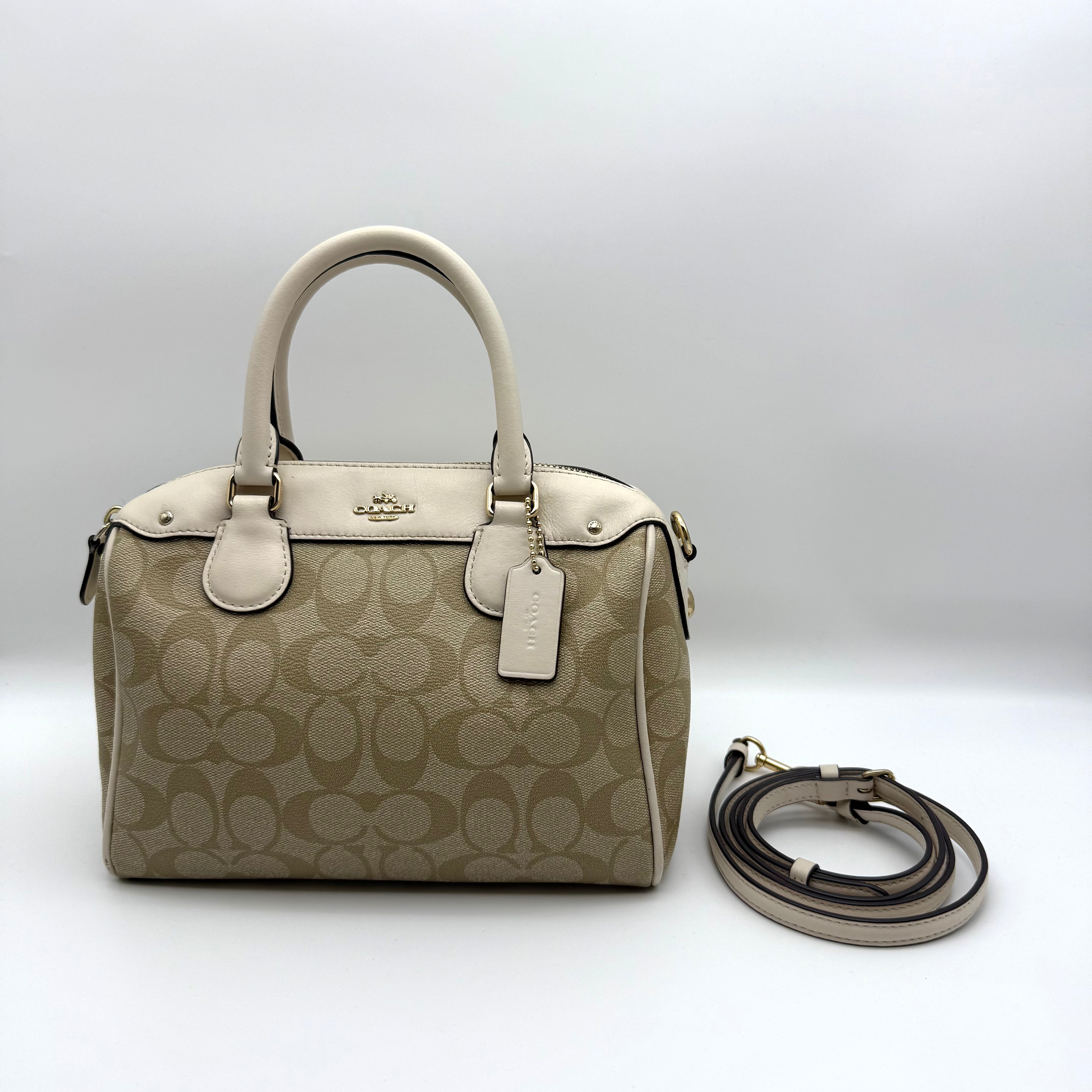 Coach Mini Bennett Boston in beige Signature jacquard with white leather trim, gold hardware, and detachable strap — pre-loved.