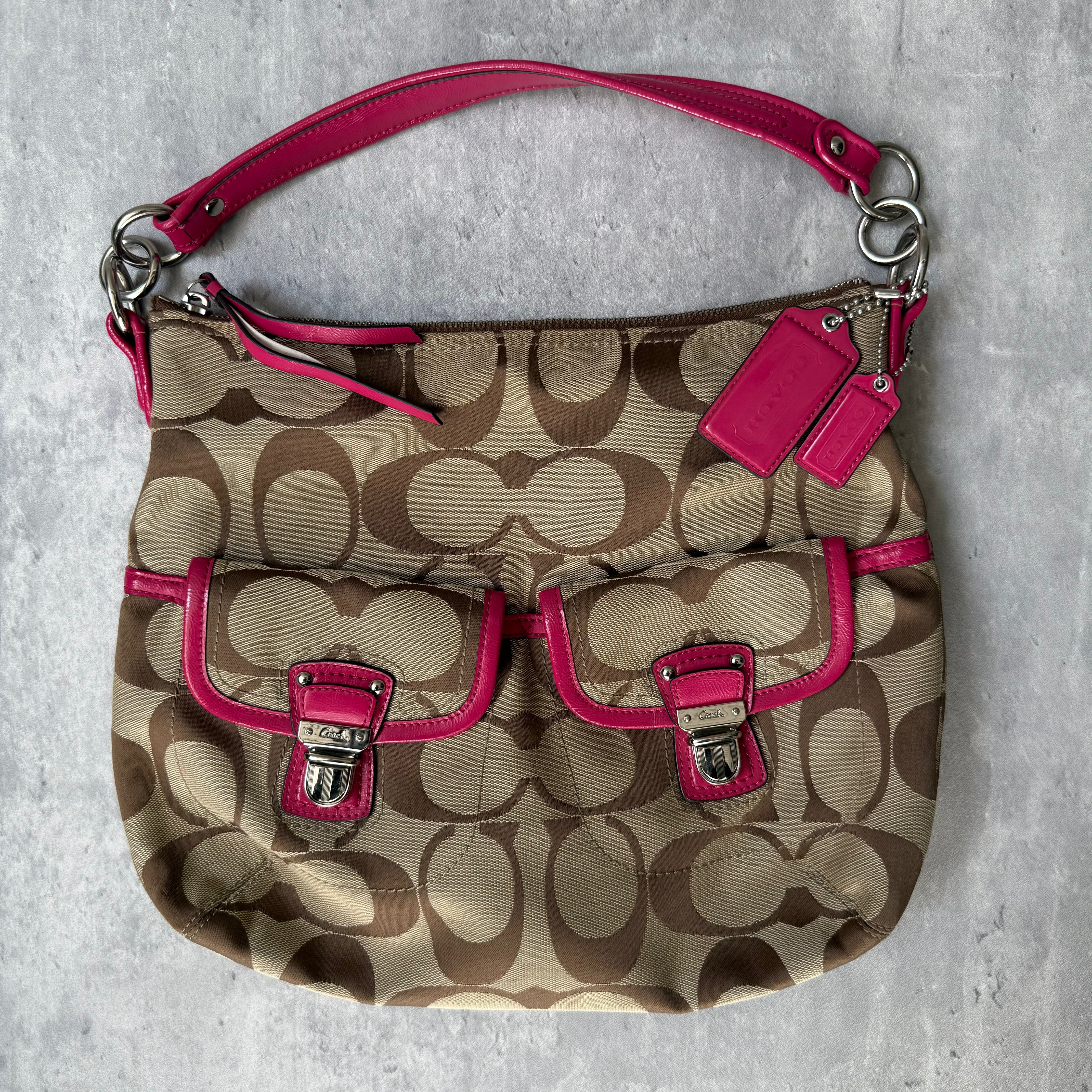 Coach 2Way Signature Pocket Hobo Daisy Bag in beige canvas with pink leather trim, dual front pockets, and detachable strap.