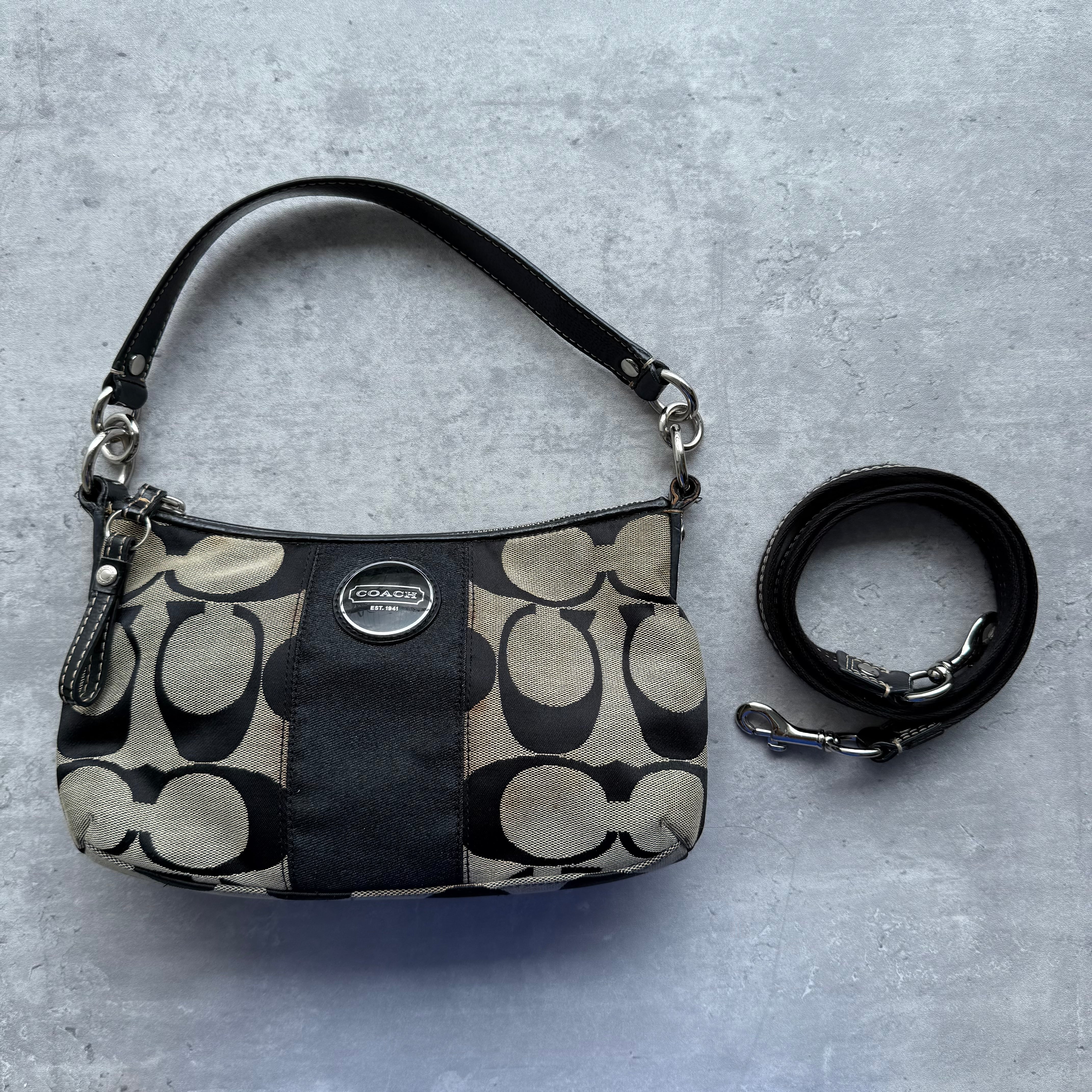 Coach 2Way Signature Stripe Shoulder Bag in grey and black jacquard with central black stripe, leather trim, silver-tone hardware, and detachable crossbody strap.