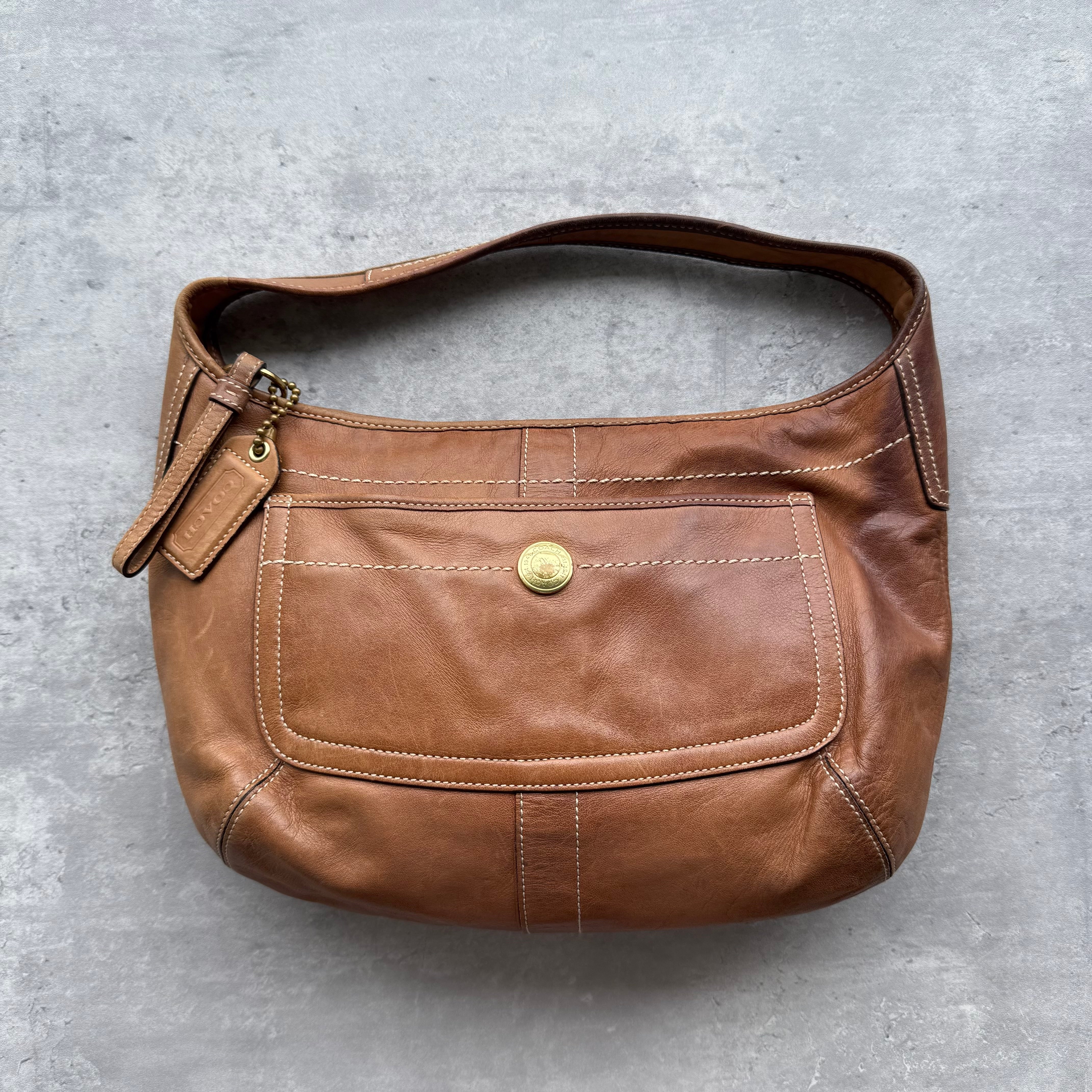 Vintage Coach Ergo Hobo Shoulder Bag in brown leather with gold-tone hardware, contrast stitching, front pocket, and zip closure