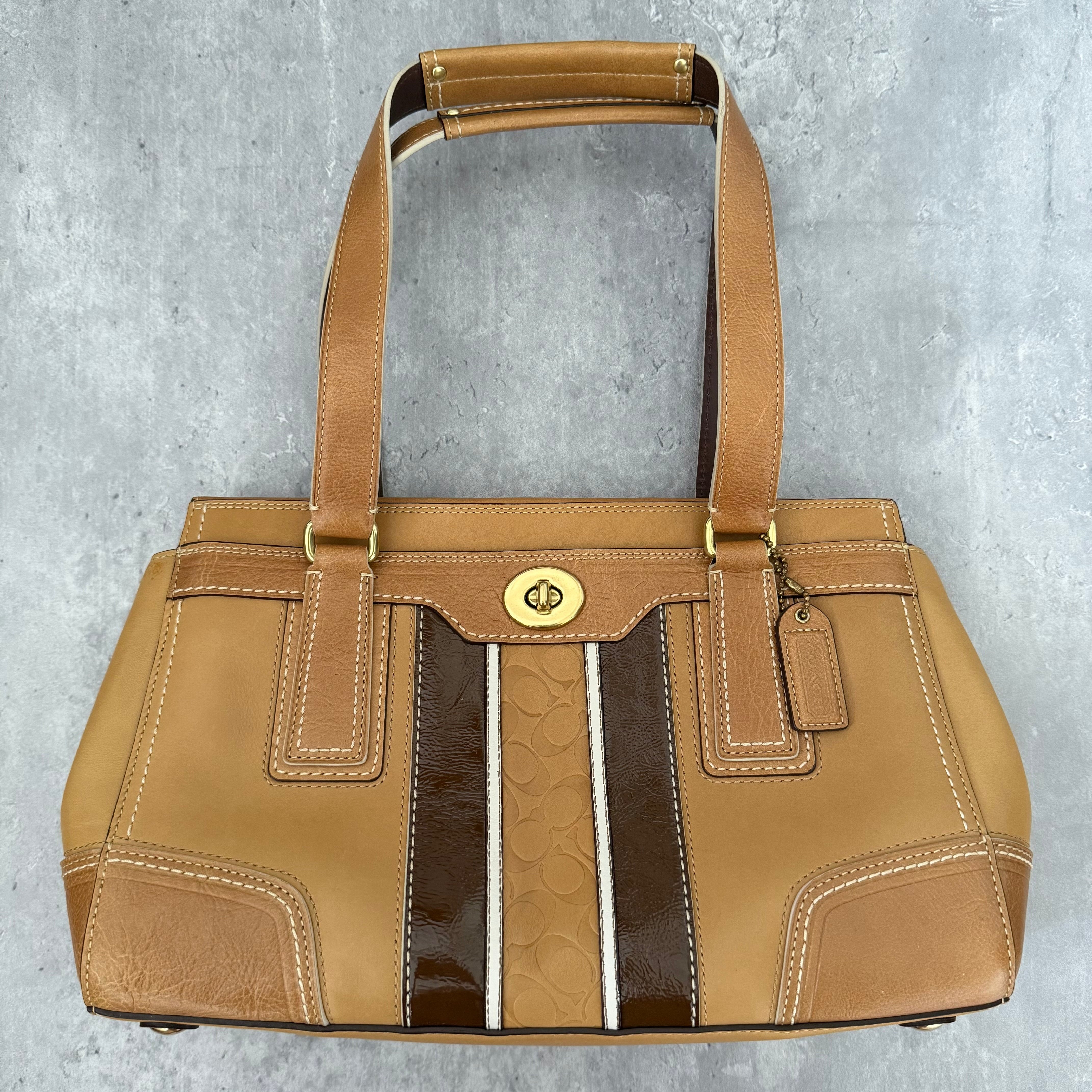 Coach Hampton Vintage Brown Beige Tan Handbag, crafted in leather with embossed signature panel, patent leather stripes, gold-tone hardware, and dual shoulder straps.