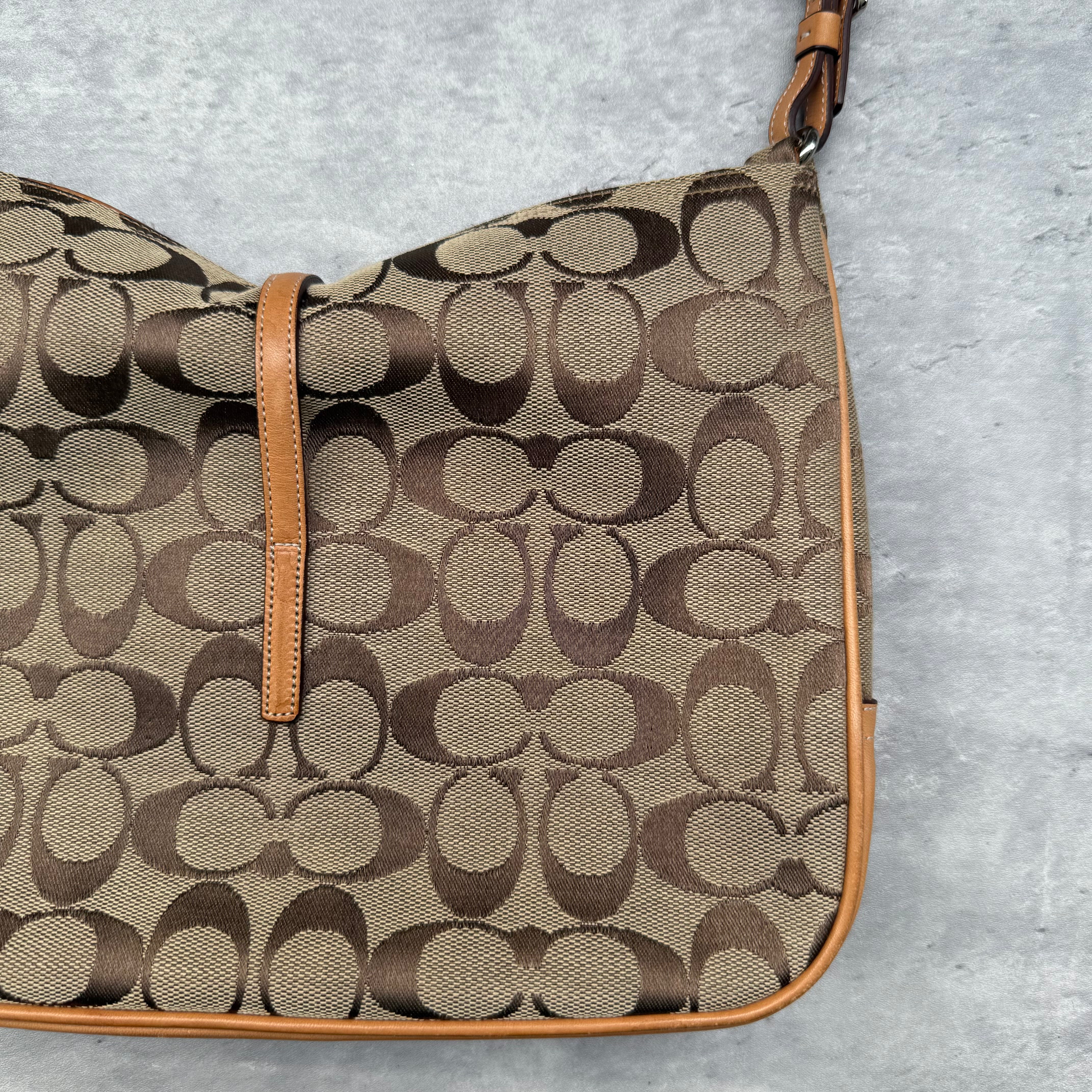 Coach Hobo Signature Clip Canvas Handbag Beige with monogram jacquard canvas, tan leather trim, front clip accent, and red-orange interior lining