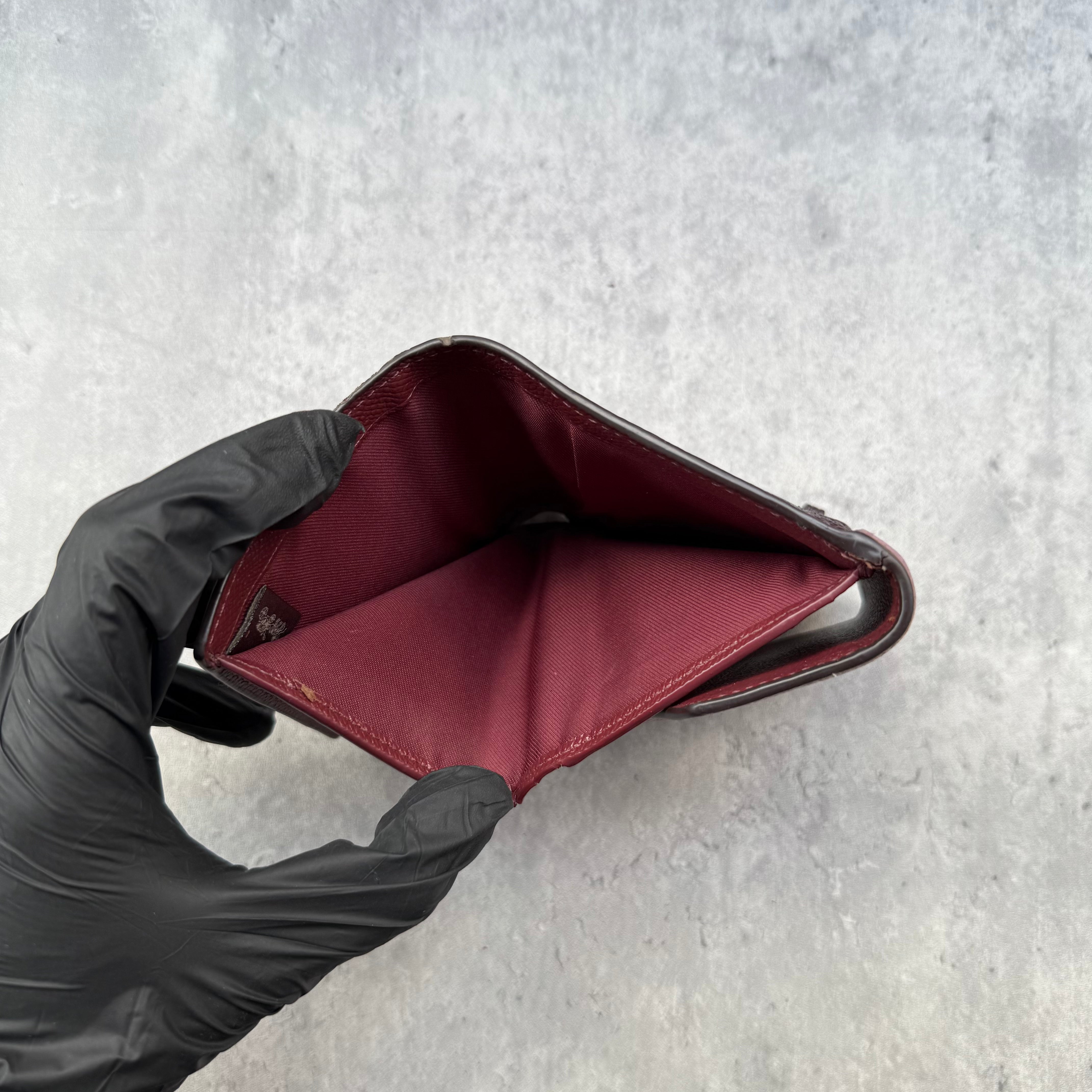 Coach Jasmine Colour-Block Small Wallet in plum, burgundy, and black pebbled leather with zip coin pocket