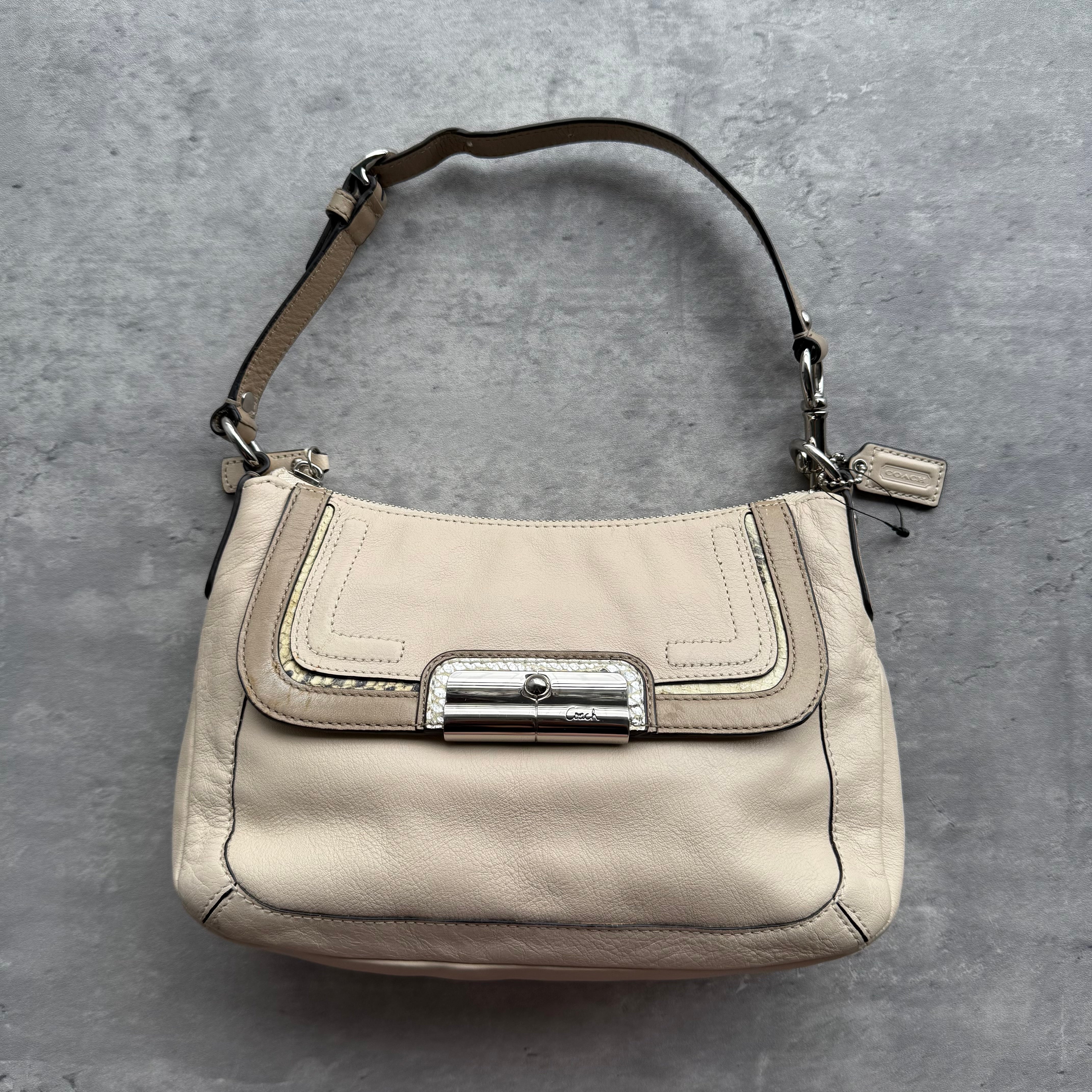 Coach Kristin Hobo Shoulder Bag in cream leather with silver-tone hardware and blush pink interior lining.