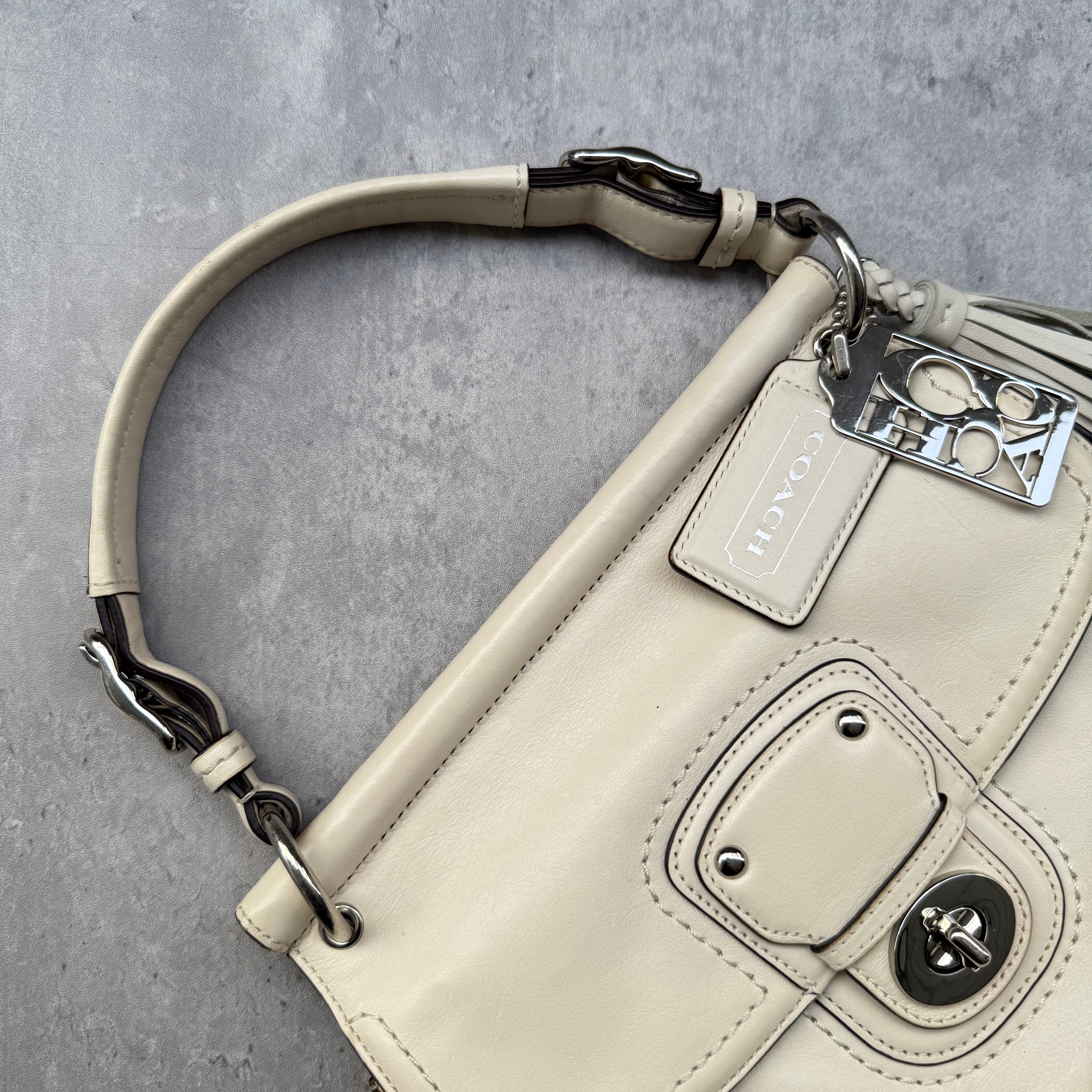 Coach Legacy Willis Tassel Handbag White with top handle, extra crossbody strap, and striped interior lining