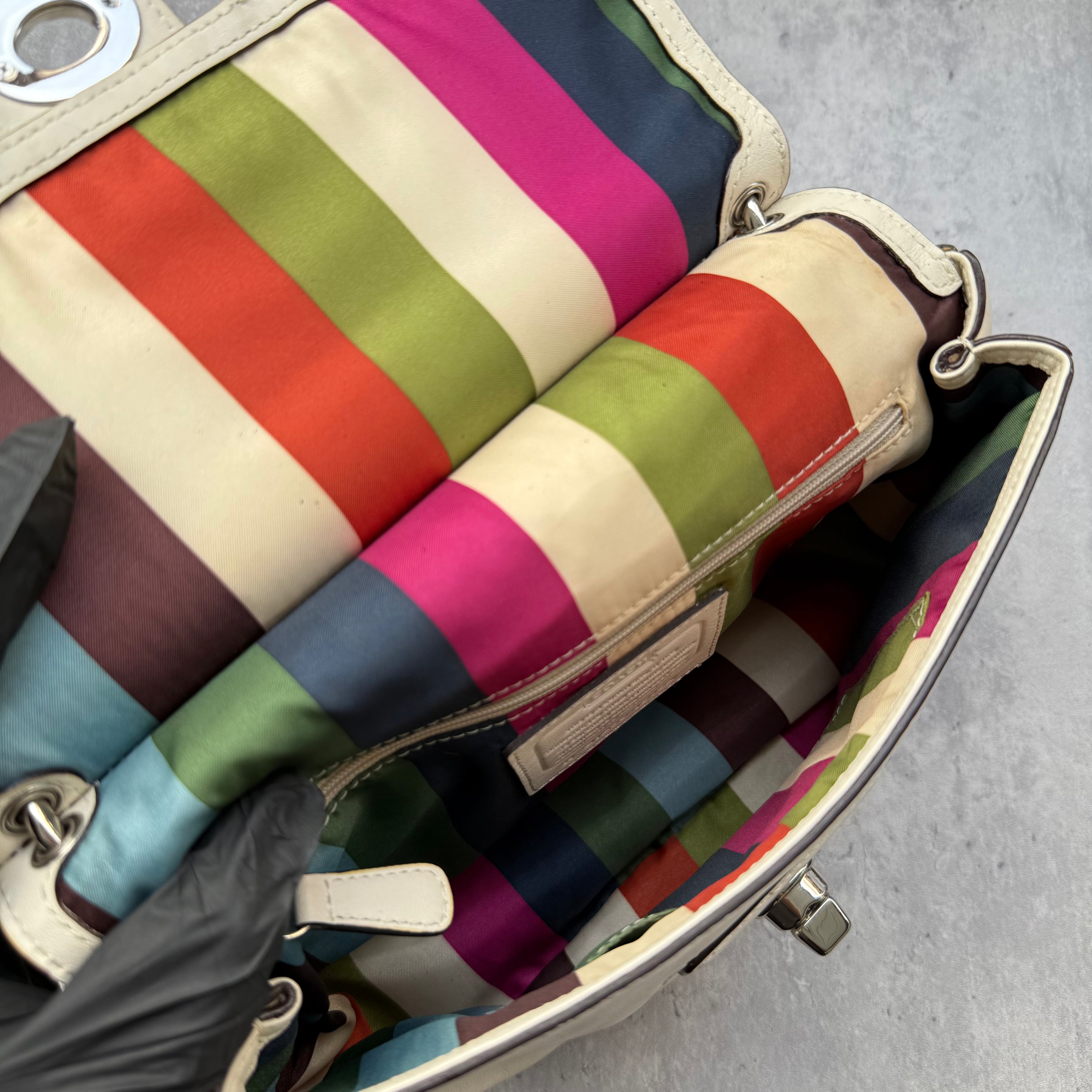 Coach Legacy Willis Tassel Handbag White with top handle, extra crossbody strap, and striped interior lining