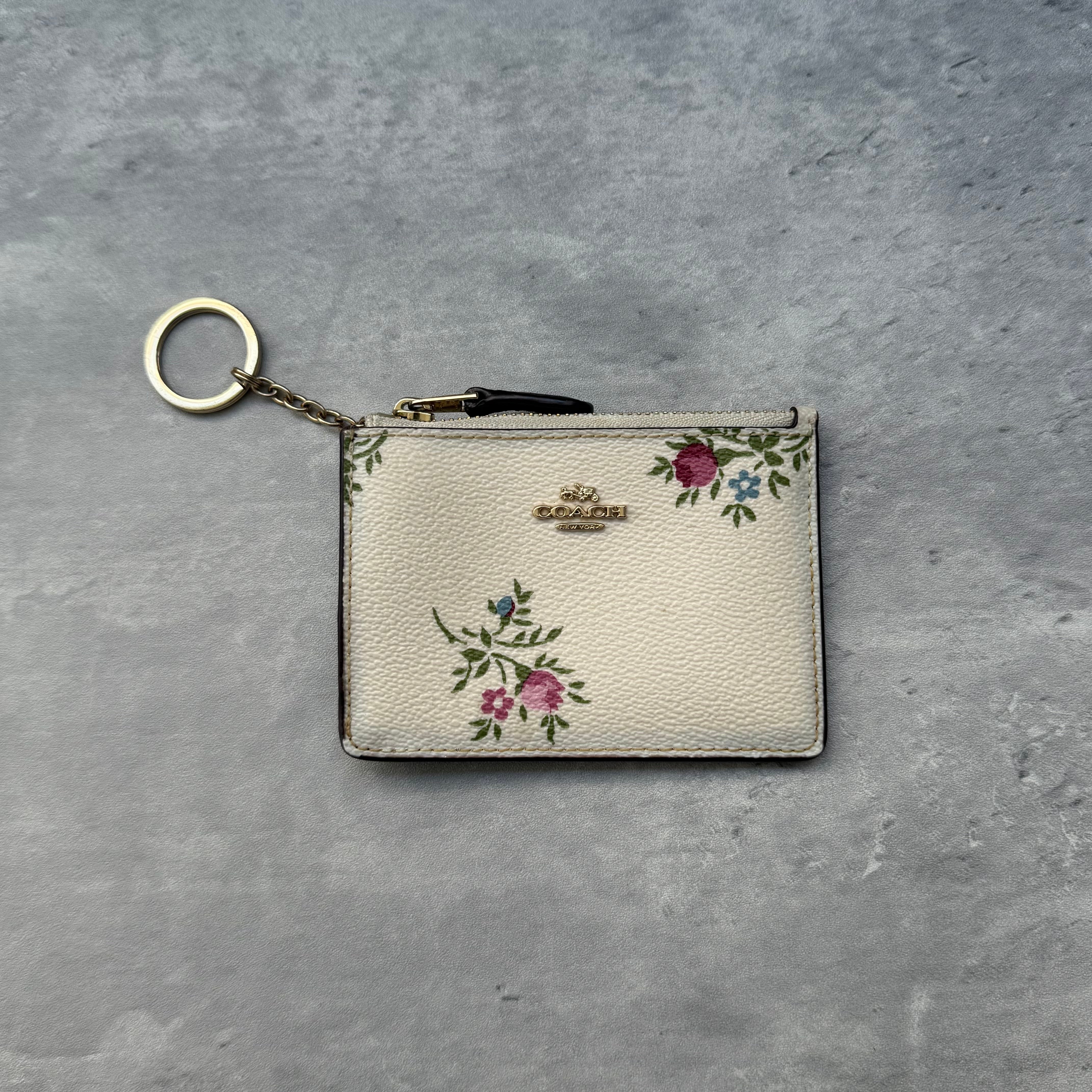 Coach Mini Skinny ID Antique Florant Print Key Cardholder in ivory pebble leather with pink floral print, zip-top closure, key ring chain, and clear ID window – Pre-loved