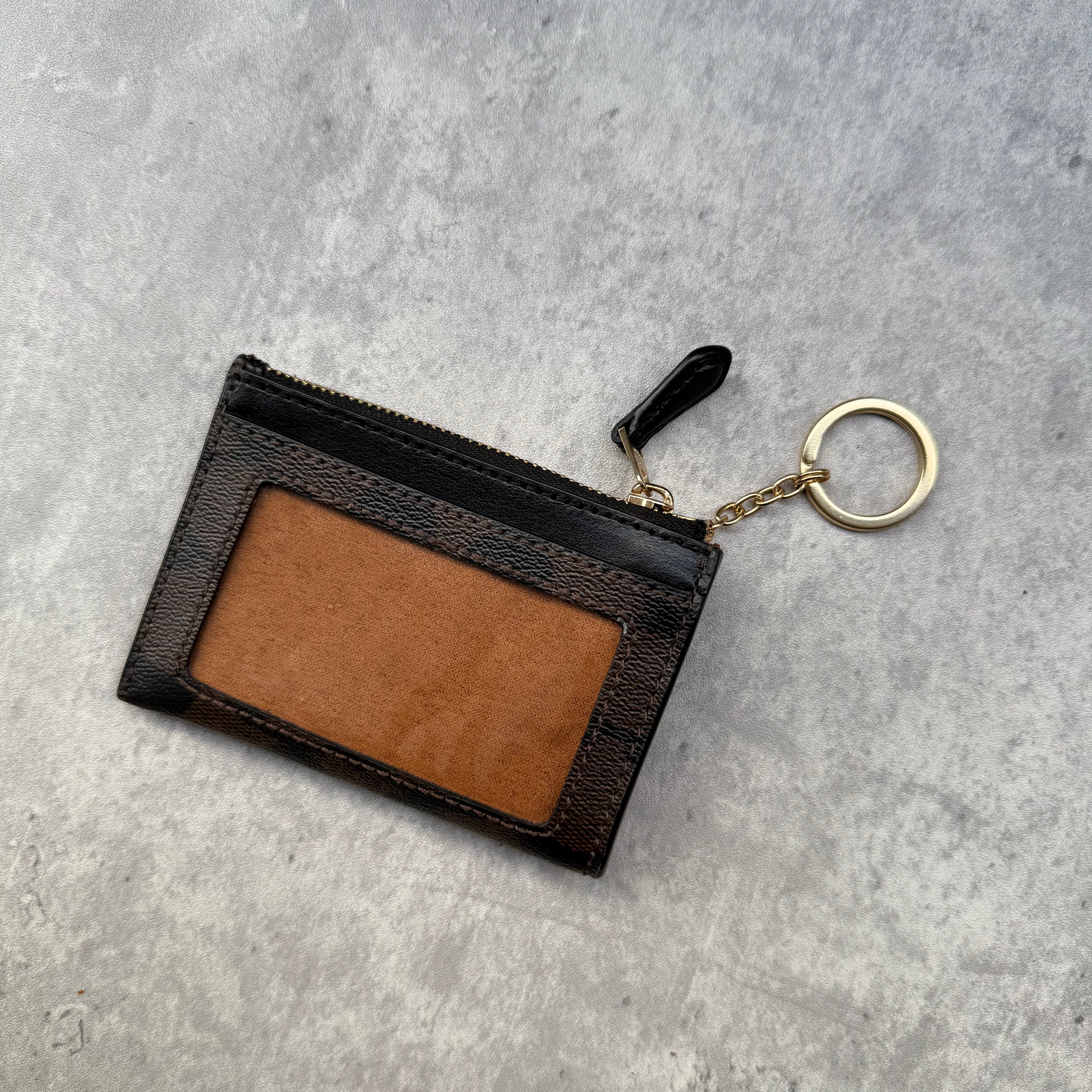 Coach Mini Skinny ID Cardholder in signature canvas with gold keyring, zip closure, and exterior ID window