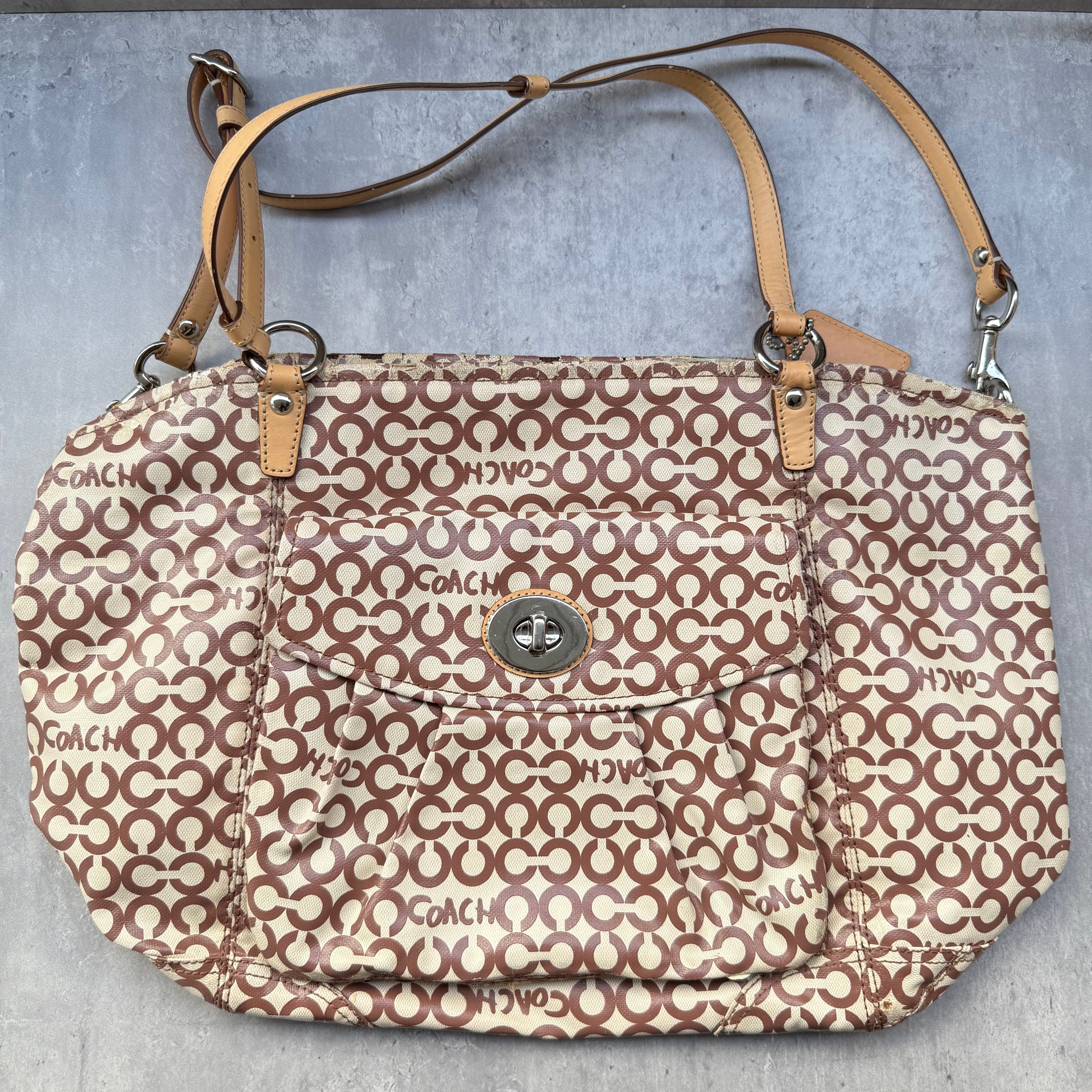 Coach Optic Art Coated Canvas Tote Bag with signature print, tan leather straps, sky blue lining, and front turn-lock pocket.