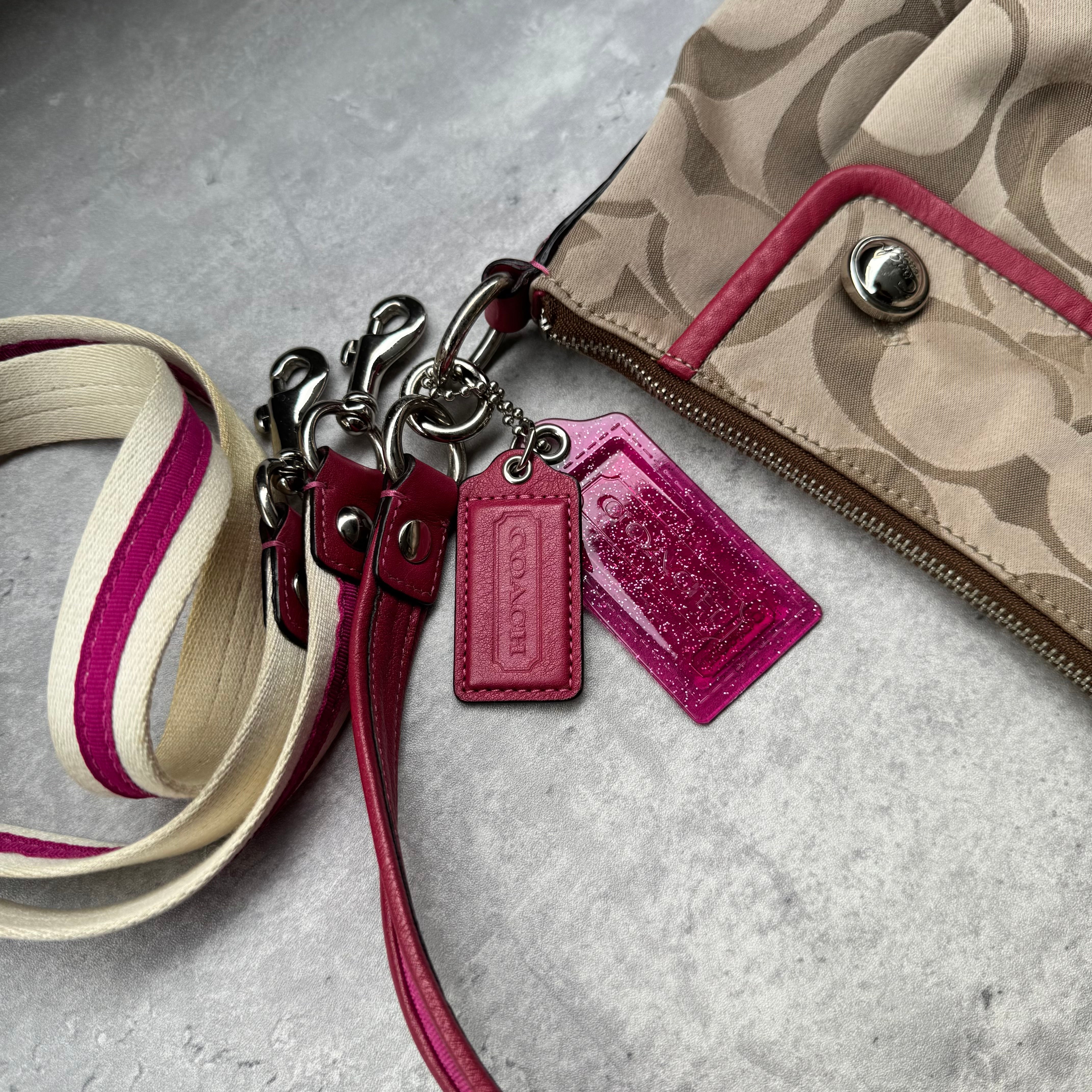Coach Poppy Signature Sateen Groovy Shoulder Bag in Beige with Pink Trim, featuring satin canvas body, silver button details, glitter hangtag, and detachable pink-striped crossbody strap.