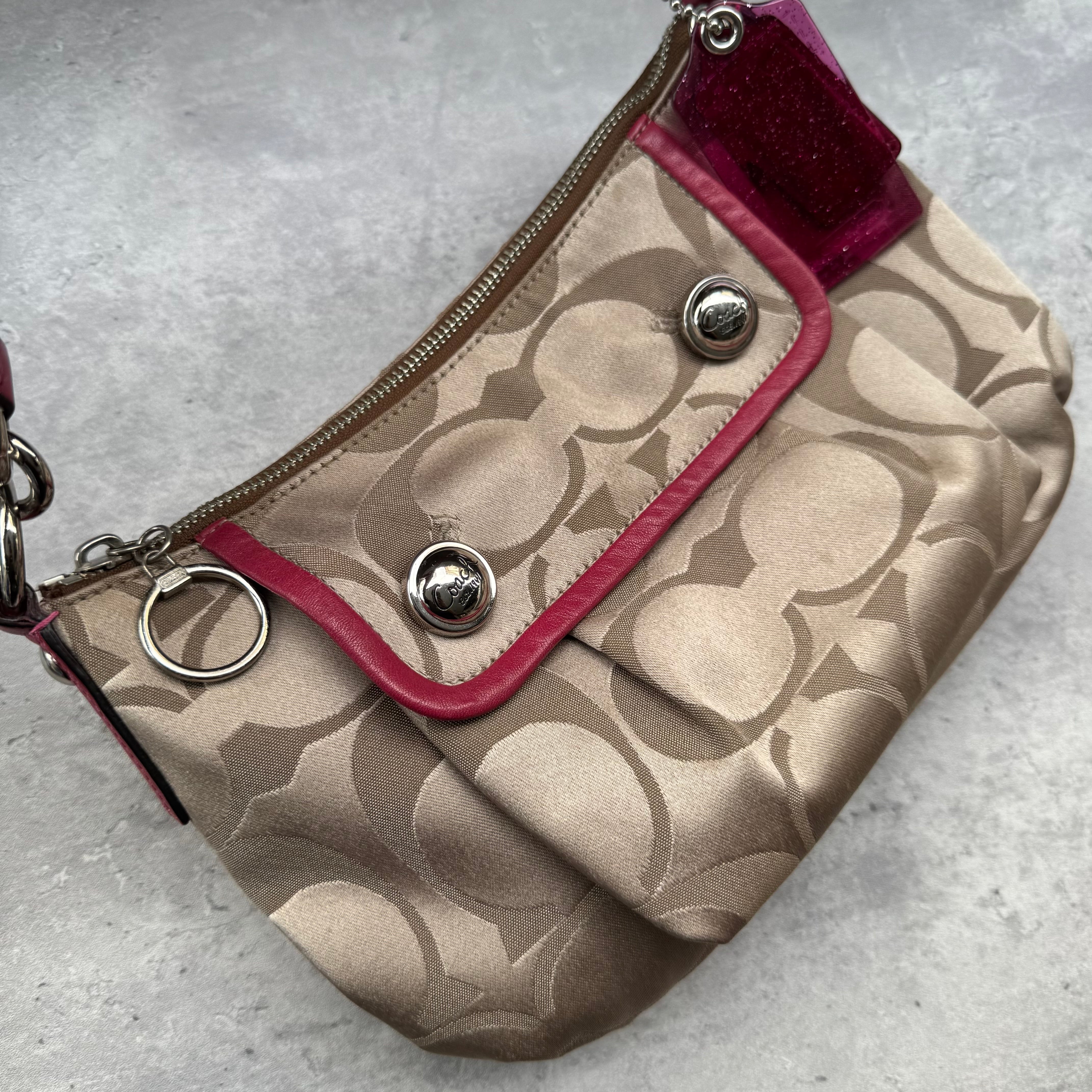 Coach Poppy Signature Sateen Groovy Shoulder Bag in Beige with Pink Trim, featuring satin canvas body, silver button details, glitter hangtag, and detachable pink-striped crossbody strap.