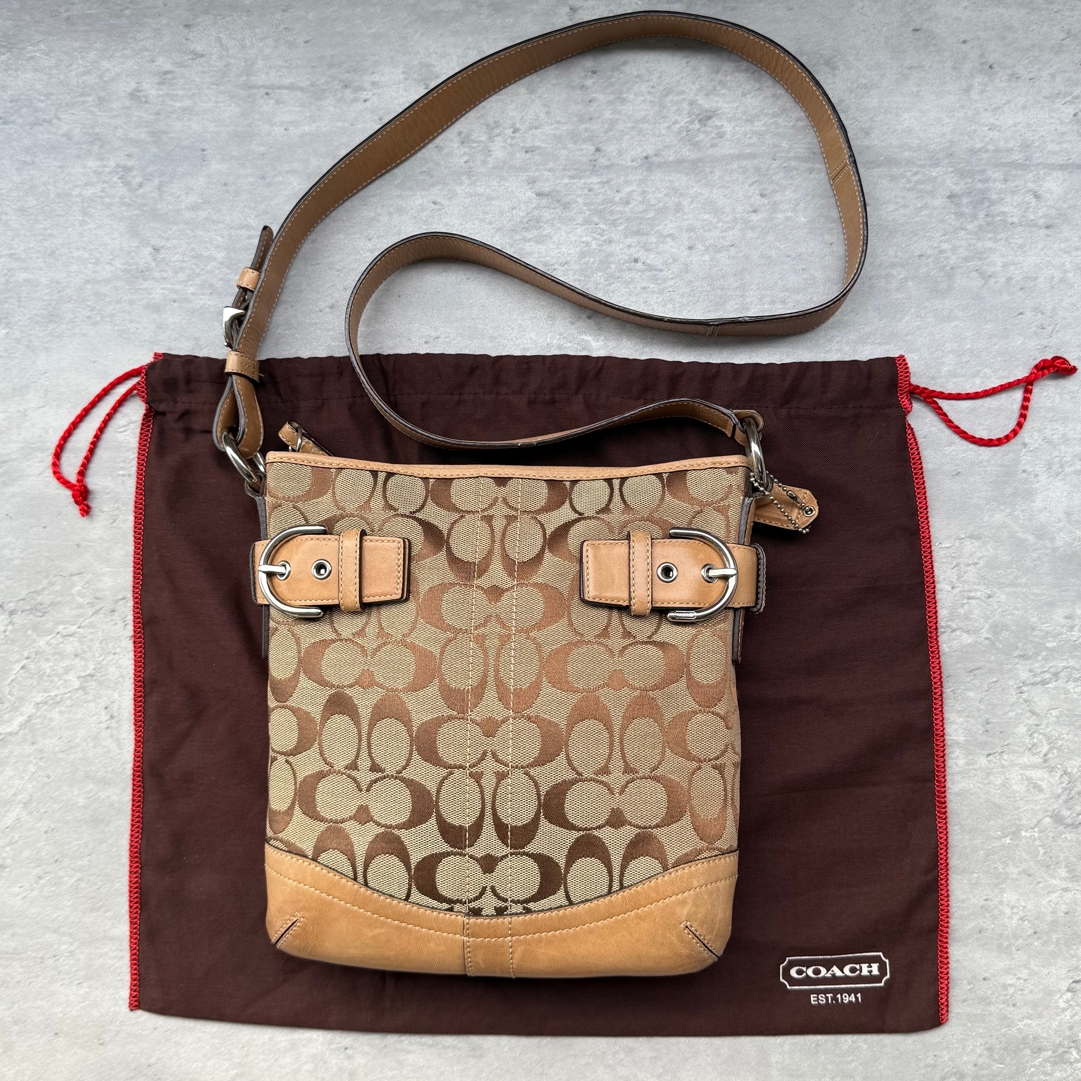 Coach Signature Canvas Crossbody Bag Beige/Tan with leather trim and buckle accents, adjustable strap, and zip closure – Pre-loved.